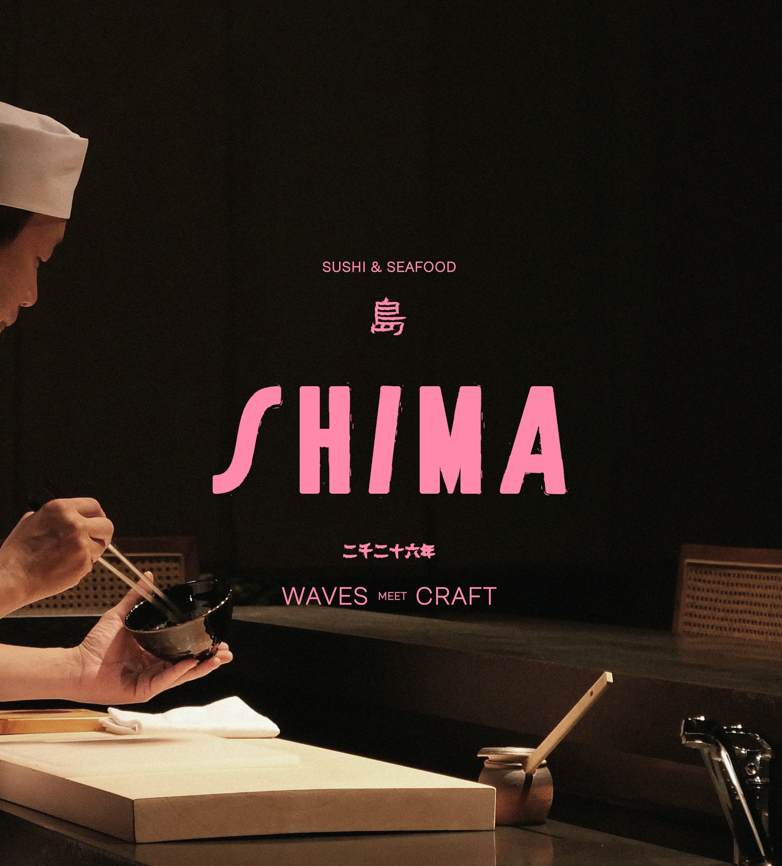 Person holding a small black bowl with chopsticks in front of a dark background with pink text that reads 'SUSHI & SEAFOOD' and Japanese characters, with a white table in the foreground.
