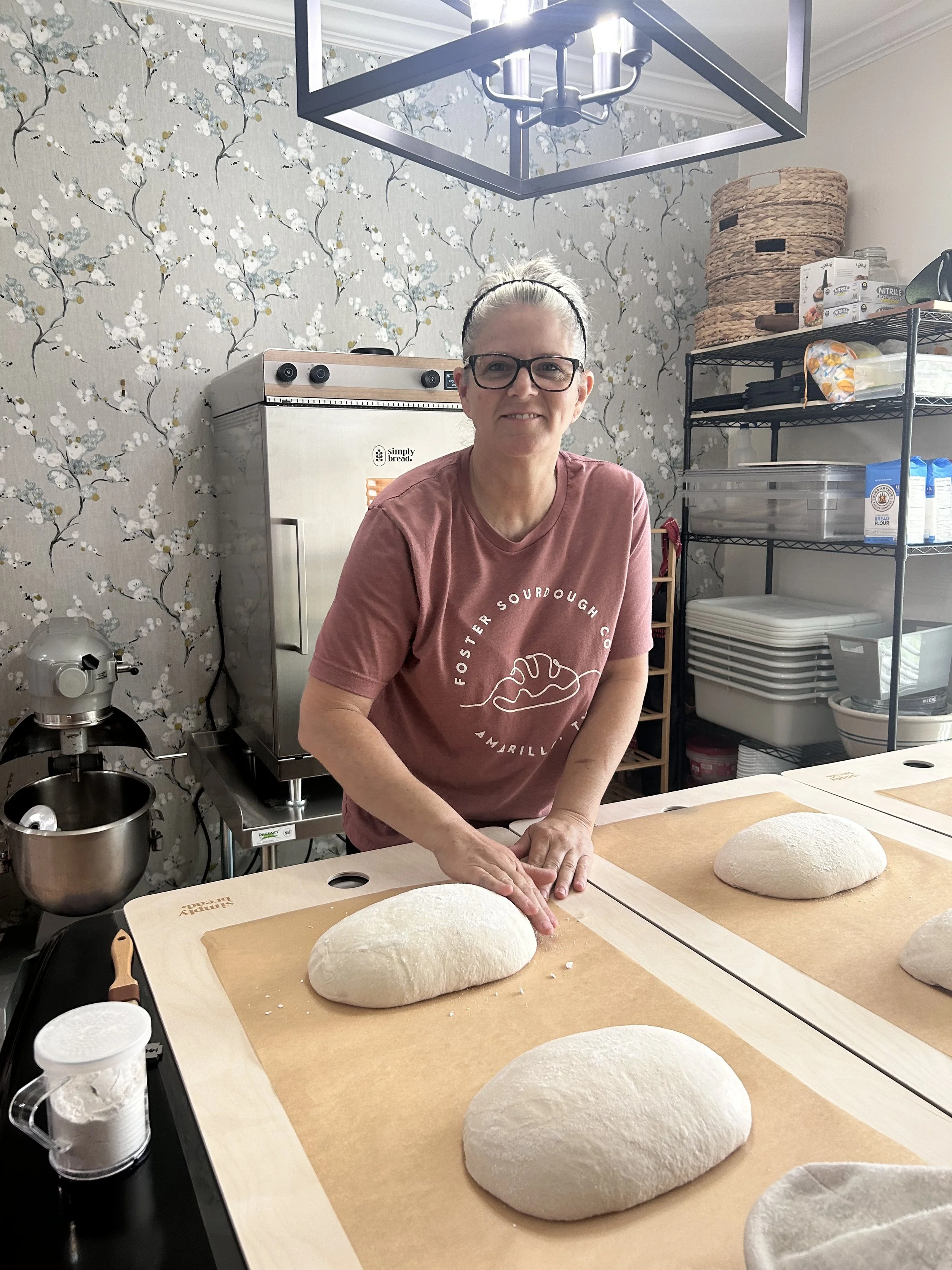 Chris Foster preparing sourdough loaves for the first Simply Bread oven in the home dining room.