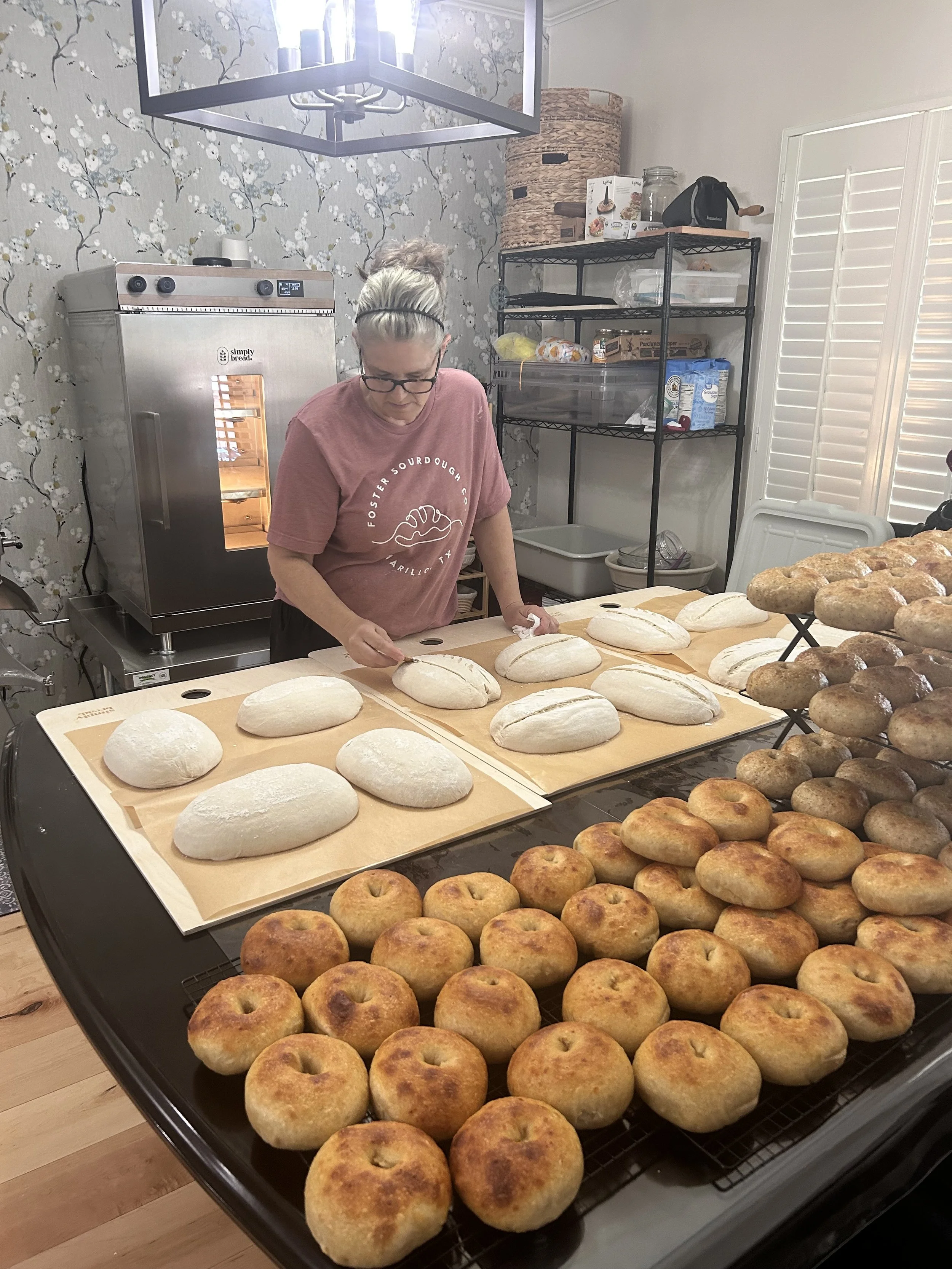 Chris Scoring loaves in her home dining room