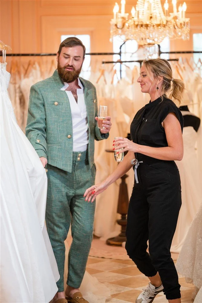 The Bridal Steward helping assist a bride with wedding day gown selection.