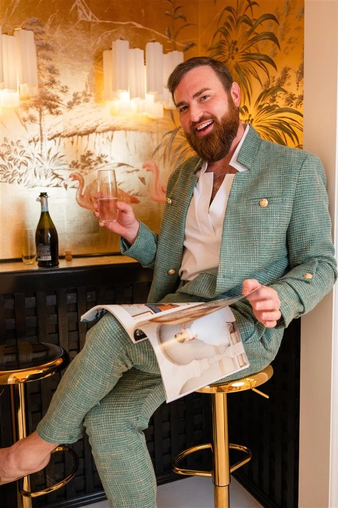 The Bridal Steward enjoying champagne while helping a bride select her wedding gown.