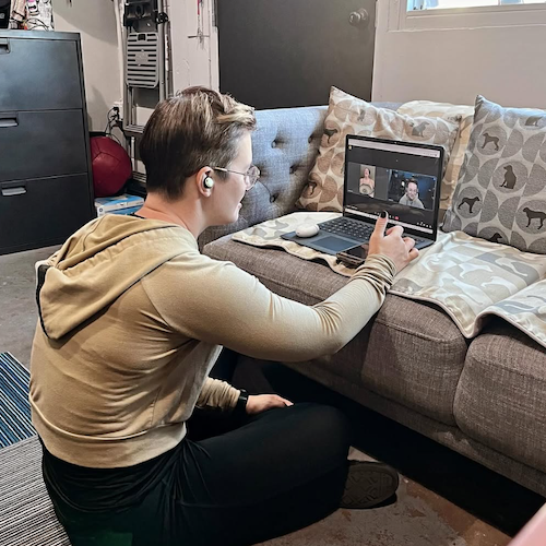 Online training session over Zoom, with trainer coaching a client over Zoom