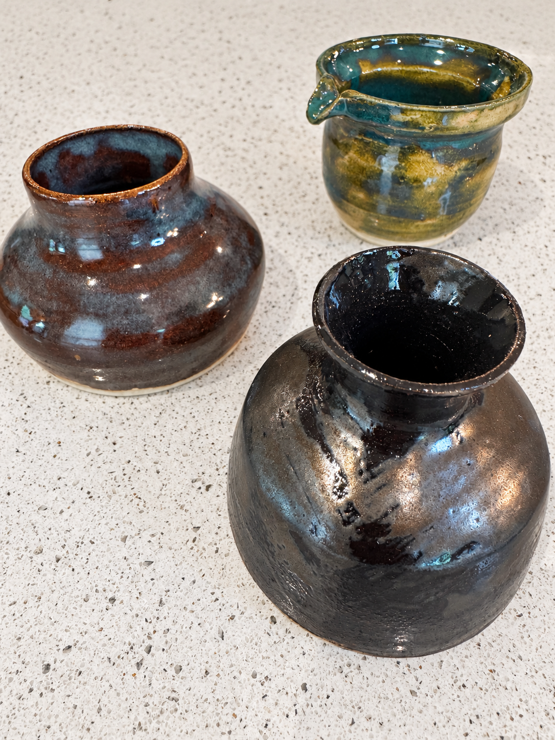 Wheel thrown vases with darker glazes
