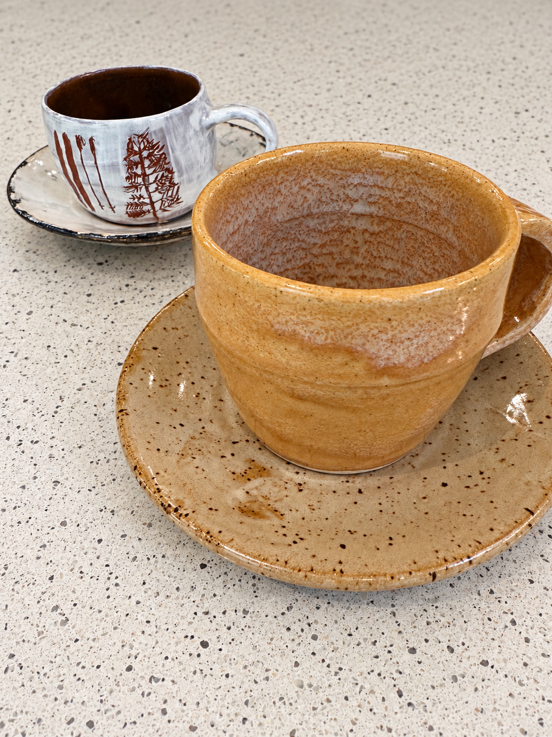 Wheel thrown tea cups and saucers