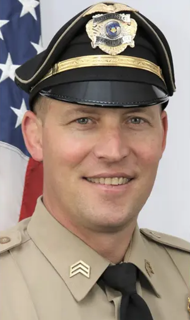Detective Sergeant Cody Becker posing in uniform