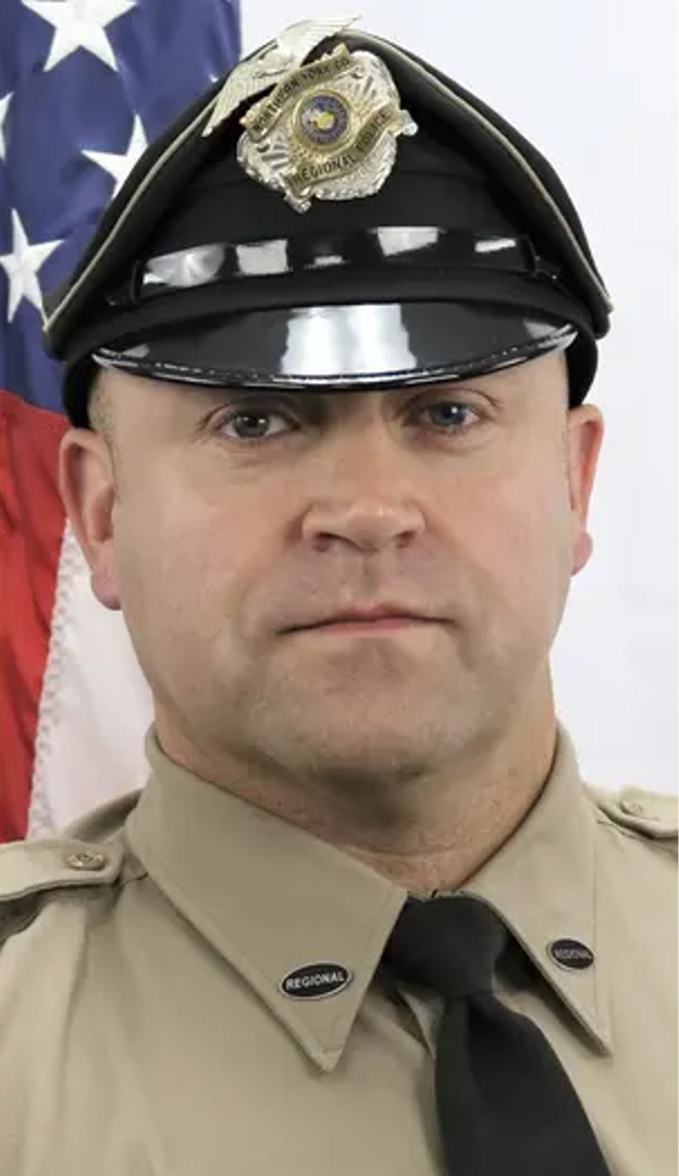 Detective Isaiah Emenheiser posing in uniform