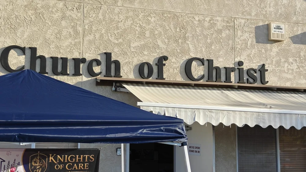 Knights of Care canopy and banner outside Ham Lane Church of Christ in Lodi