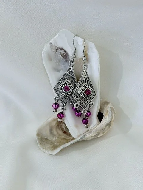 Pink and Silver Colored Earrings.