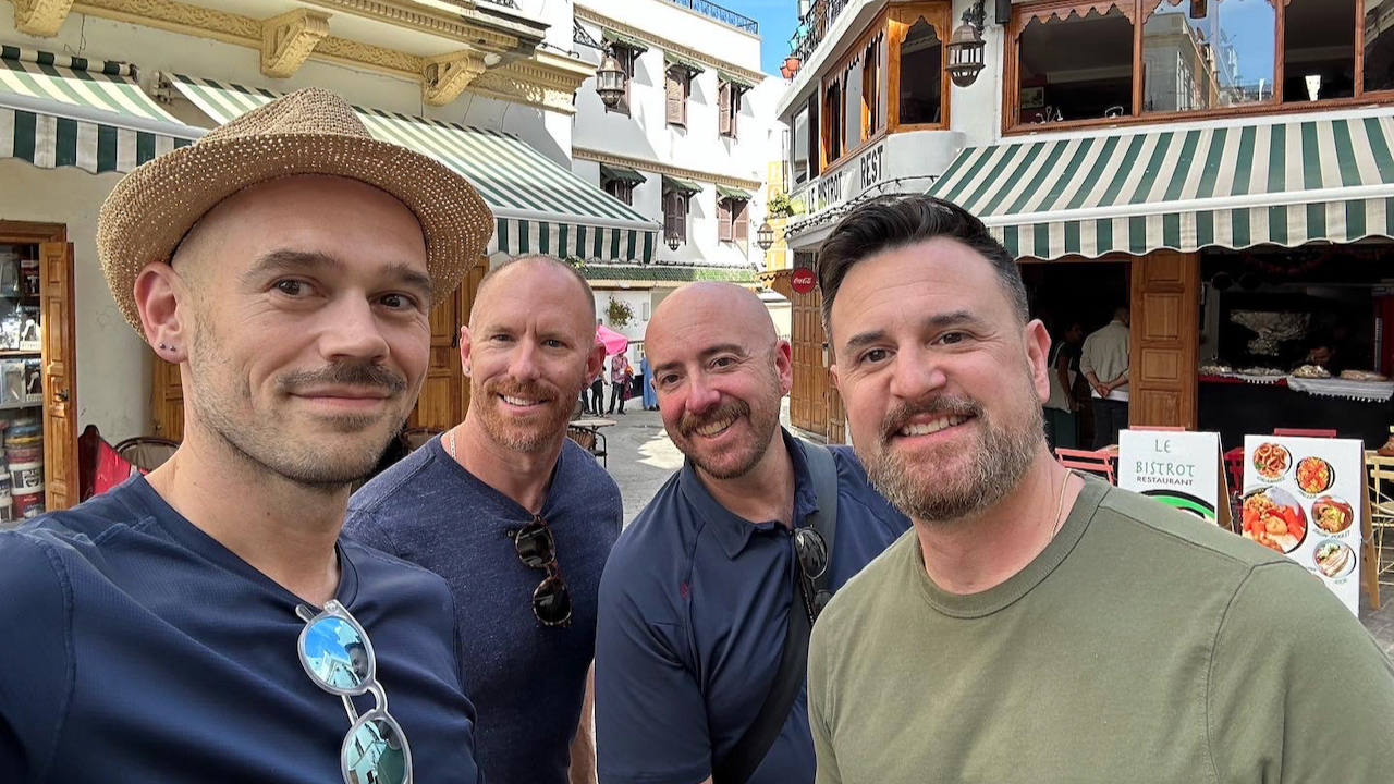 Four friends together on a street in Tangier, Morocco.