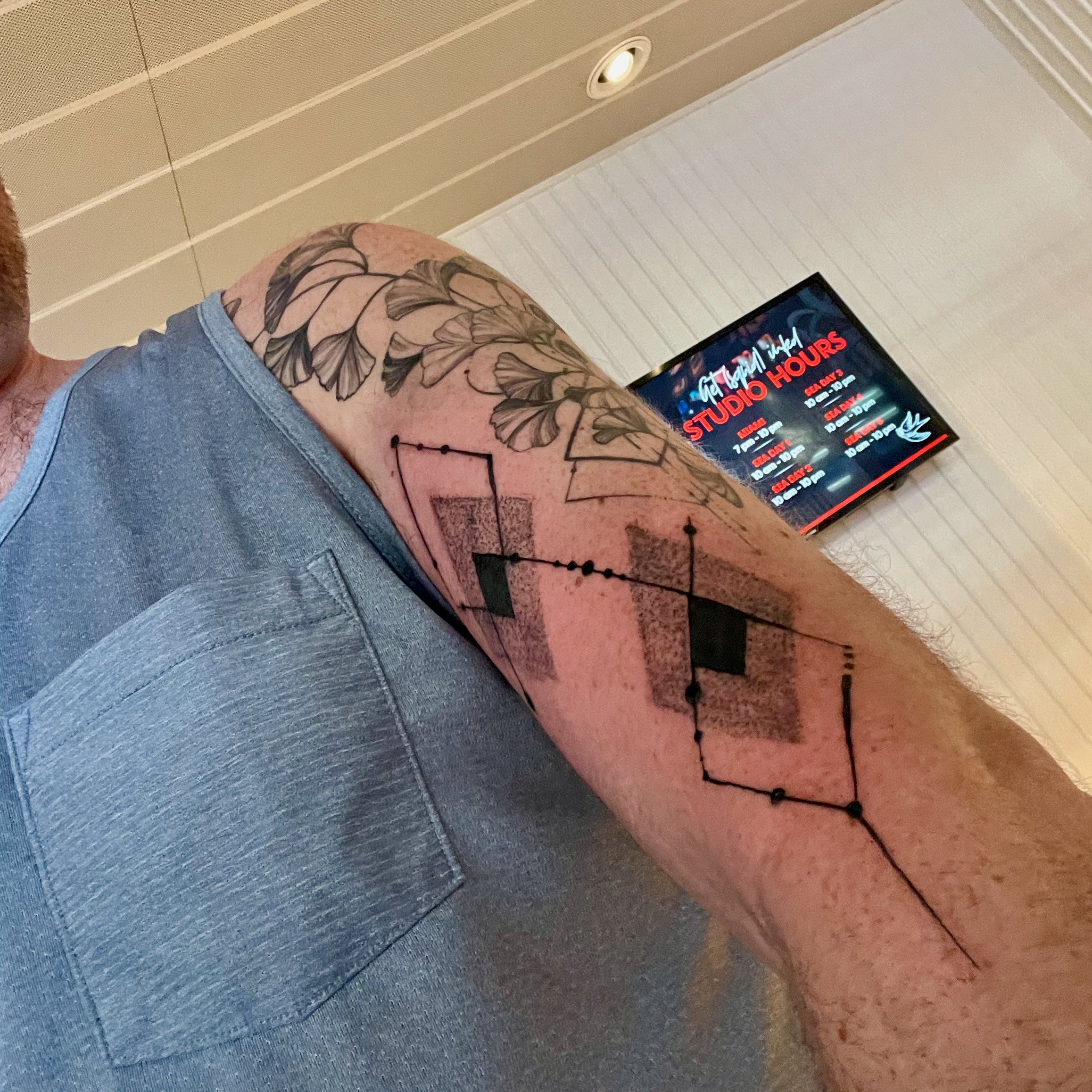 1. An argyle-pattern tattoo on a forearm.