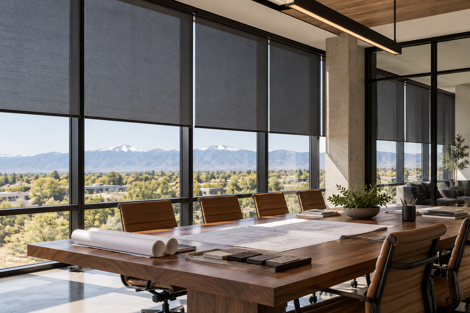 Commercial meeting room with tailored solar shades on tall windows