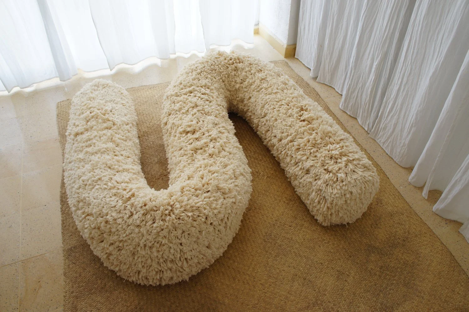 Mexchic Shag throw pillow, rug, jacket, purse texture handwoven in cream cotton, artisan made textile in Clothing craft shopping in Oaxaca Mexico. The Mexican textile is made with handwoven cotton made on a loom. Moroccan wedding blanket loops beddin