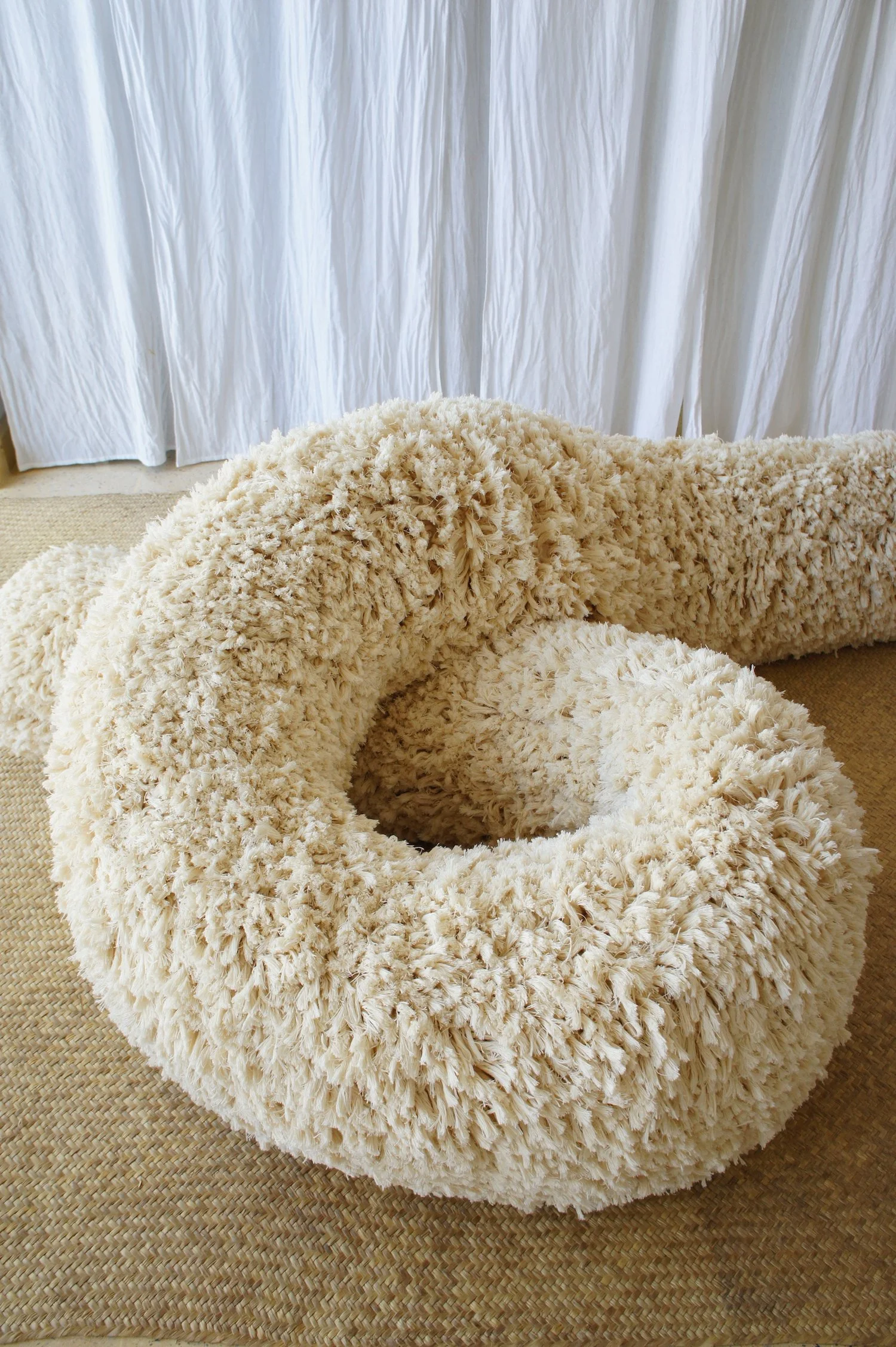 Mexchic Shag throw pillow, rug, jacket, purse texture handwoven in cream cotton, artisan made textile in Clothing craft shopping in Oaxaca Mexico. The Mexican textile is made with handwoven cotton made on a loom. Moroccan wedding blanket loops beddin