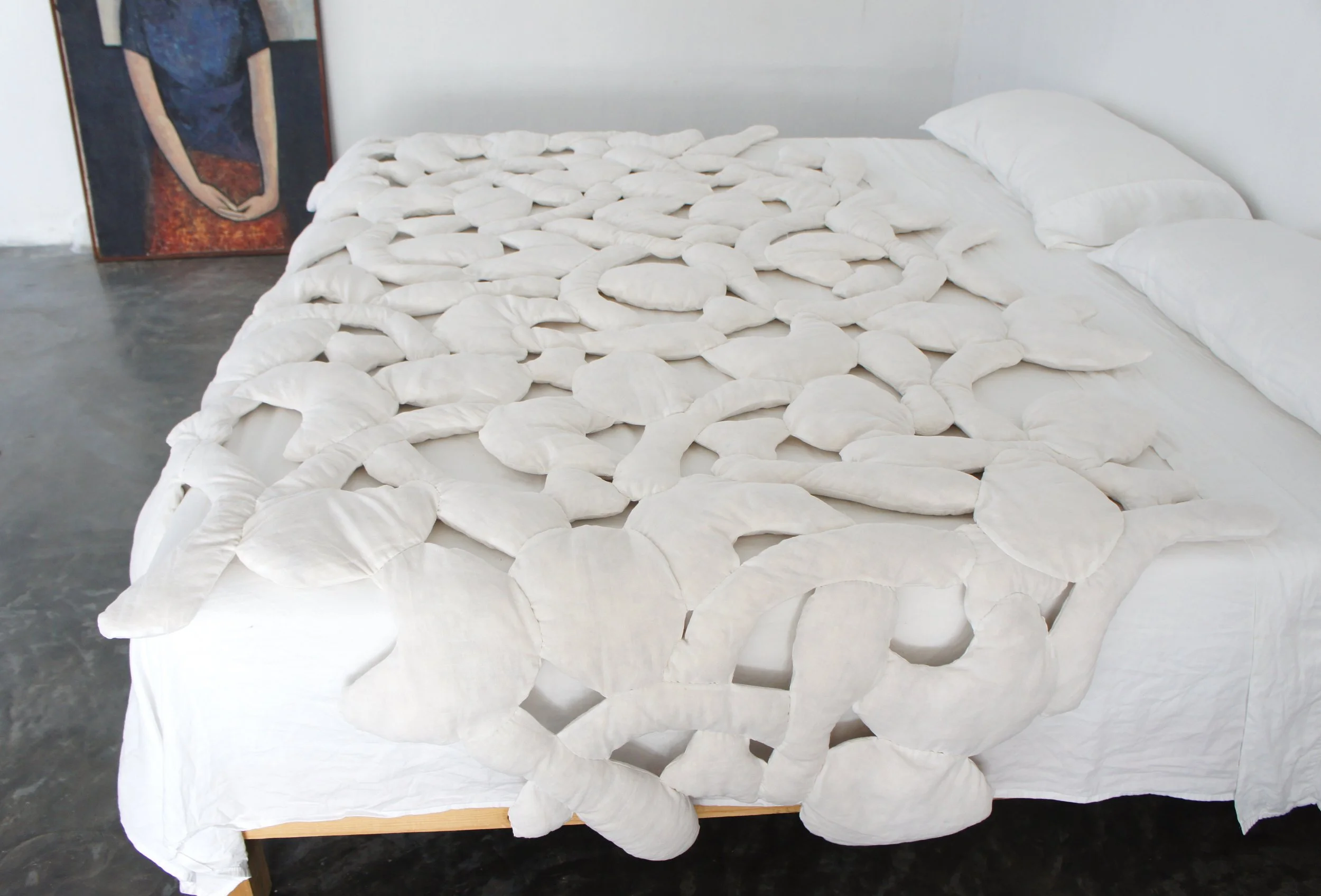 Mexchic soft sculpture mexchic pillow bones huesitos three dimensional 3-D quilt oaxaca mexico christina hattler contemporary craft art artisanal textile handmade hand sewn linen ceiba pochote kapok fiber artist 