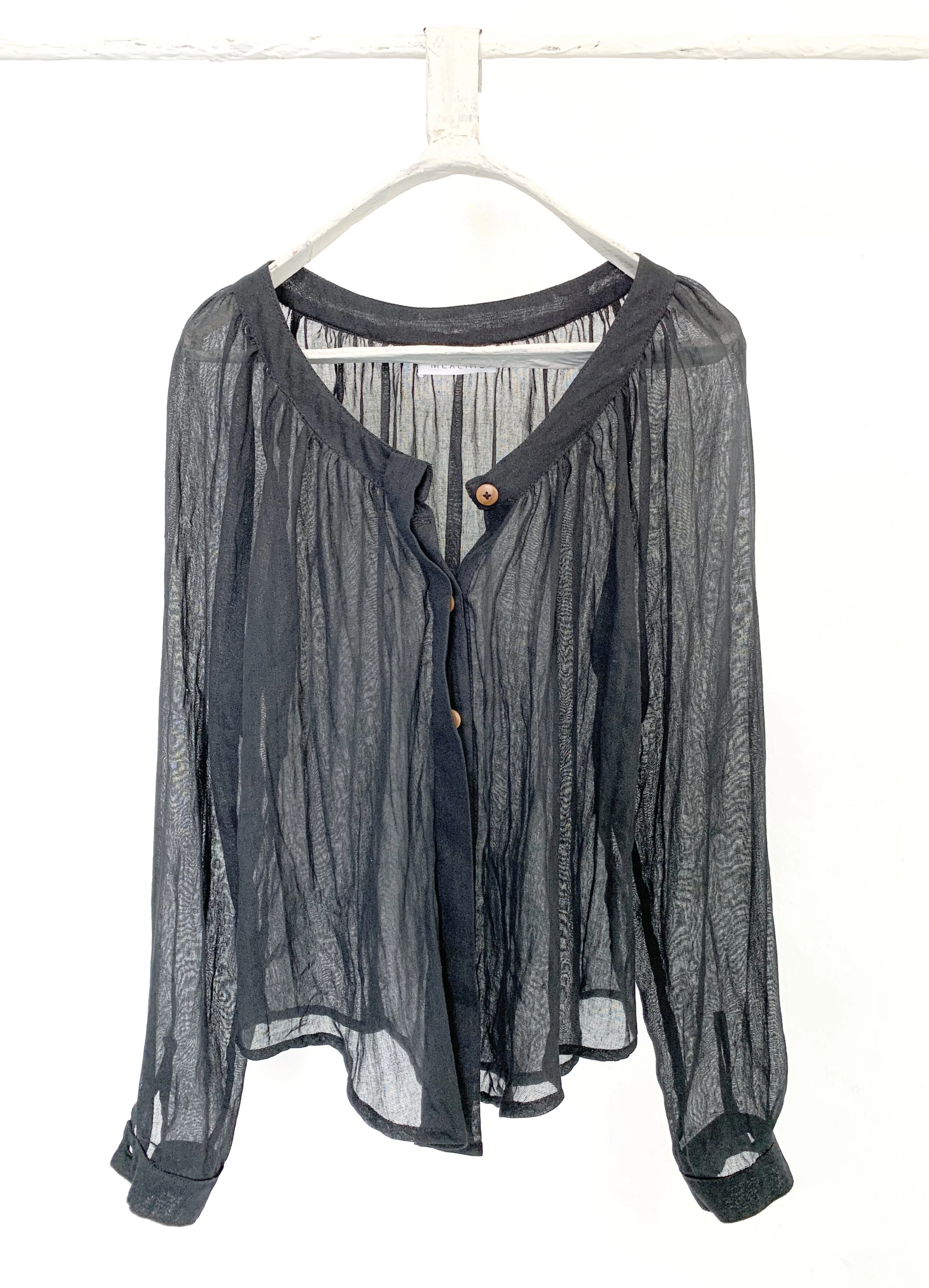Mexchic clothing collection Anatomy shopping in Oaxaca, Mexico, simple, minimal, minimalist handmade with natural fabrics and fibers, ecological botanical dyes, regenerative cotton, and wool with Mexican artisans, weavers, spinners, red pottery baro 