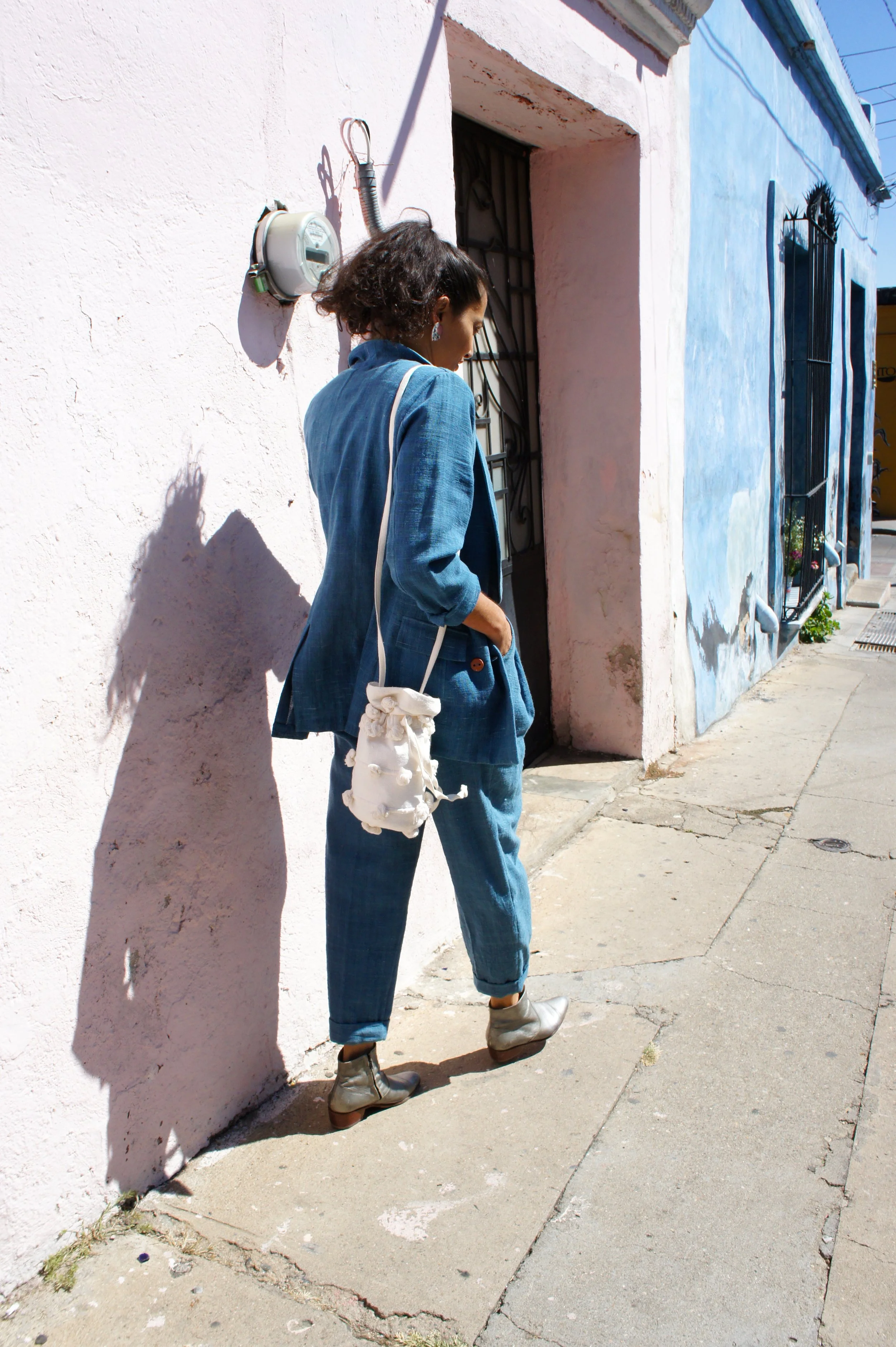 Mexchic clothing collection Anatomy shopping in Oaxaca, Mexico, simple, minimal, minimalist handmade with natural fabrics and fibers, ecological botanical dyes, regenerative cotton, and wool with Mexican artisans, weavers, spinners, red pottery baro 