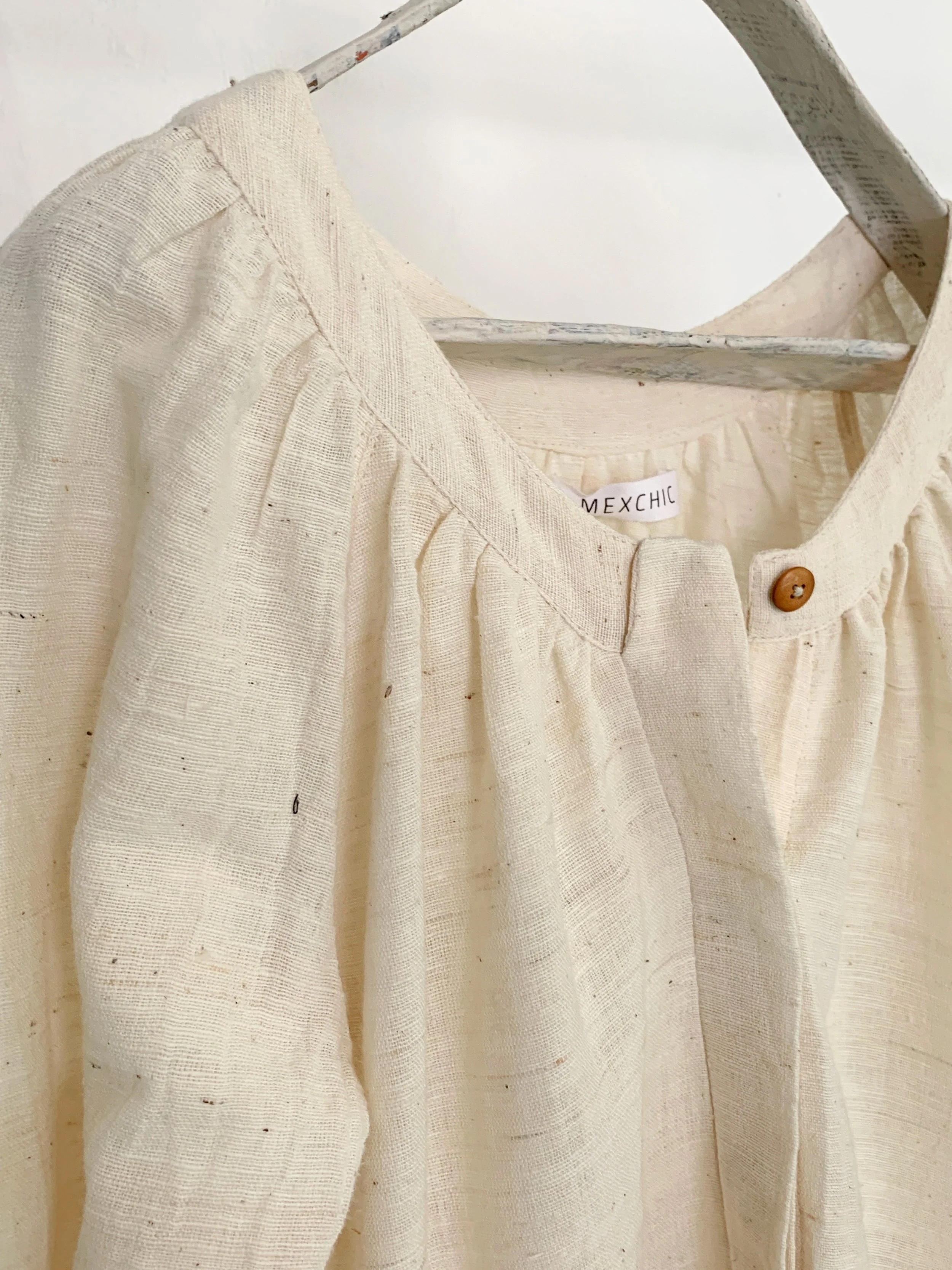 Mexchic clothing collection Anatomy shopping in Oaxaca, Mexico, simple, minimal, minimalist handmade with natural fabrics and fibers, ecological botanical dyes, regenerative cotton, and wool with Mexican artisans, weavers, spinners, red pottery baro 