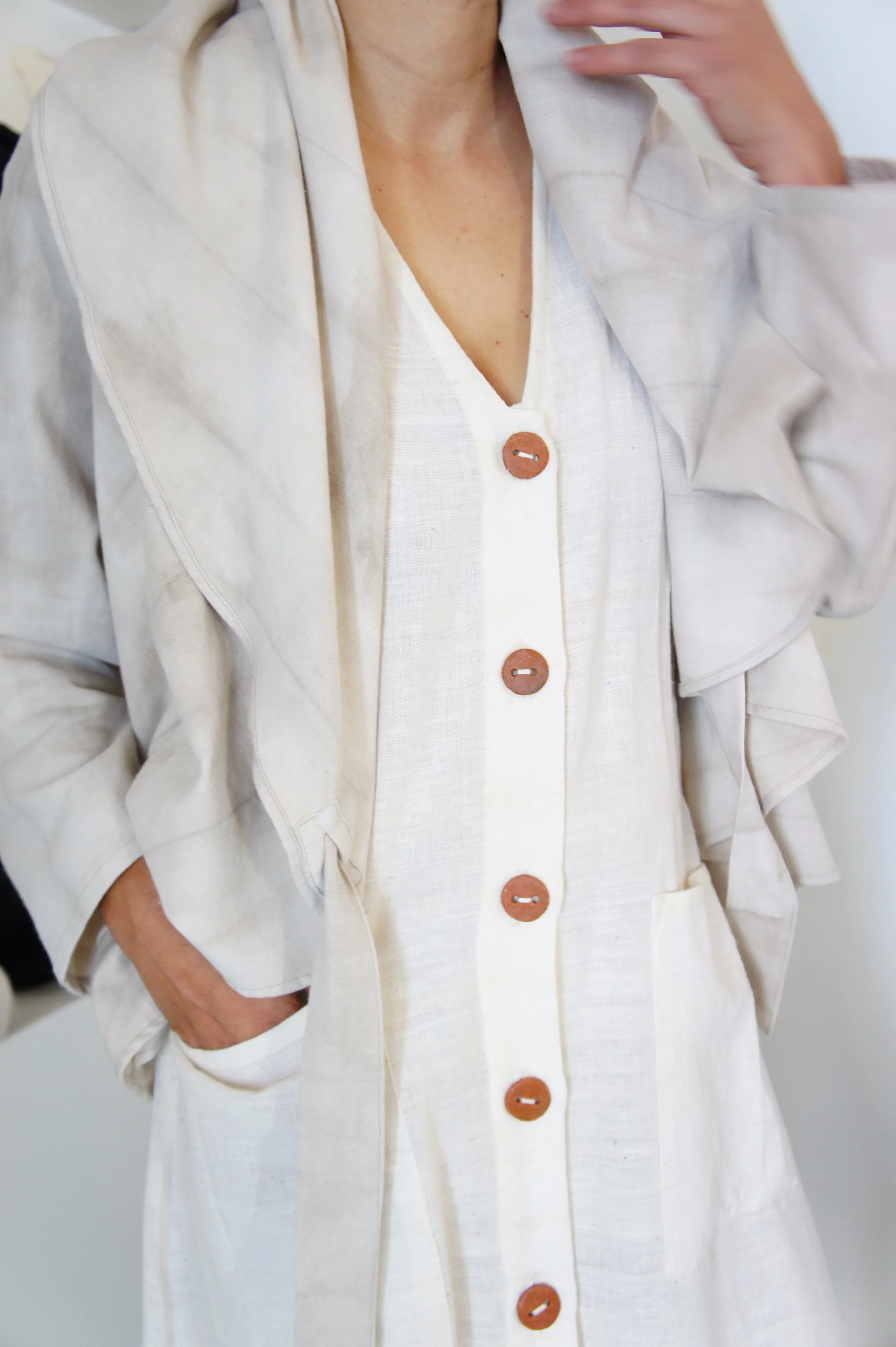 Mexchic clothing collection Anatomy shopping in Oaxaca, Mexico, simple, minimal, minimalist handmade with natural fabrics and fibers, ecological botanical dyes, regenerative cotton, and wool with Mexican artisans, weavers, spinners, red pottery baro 