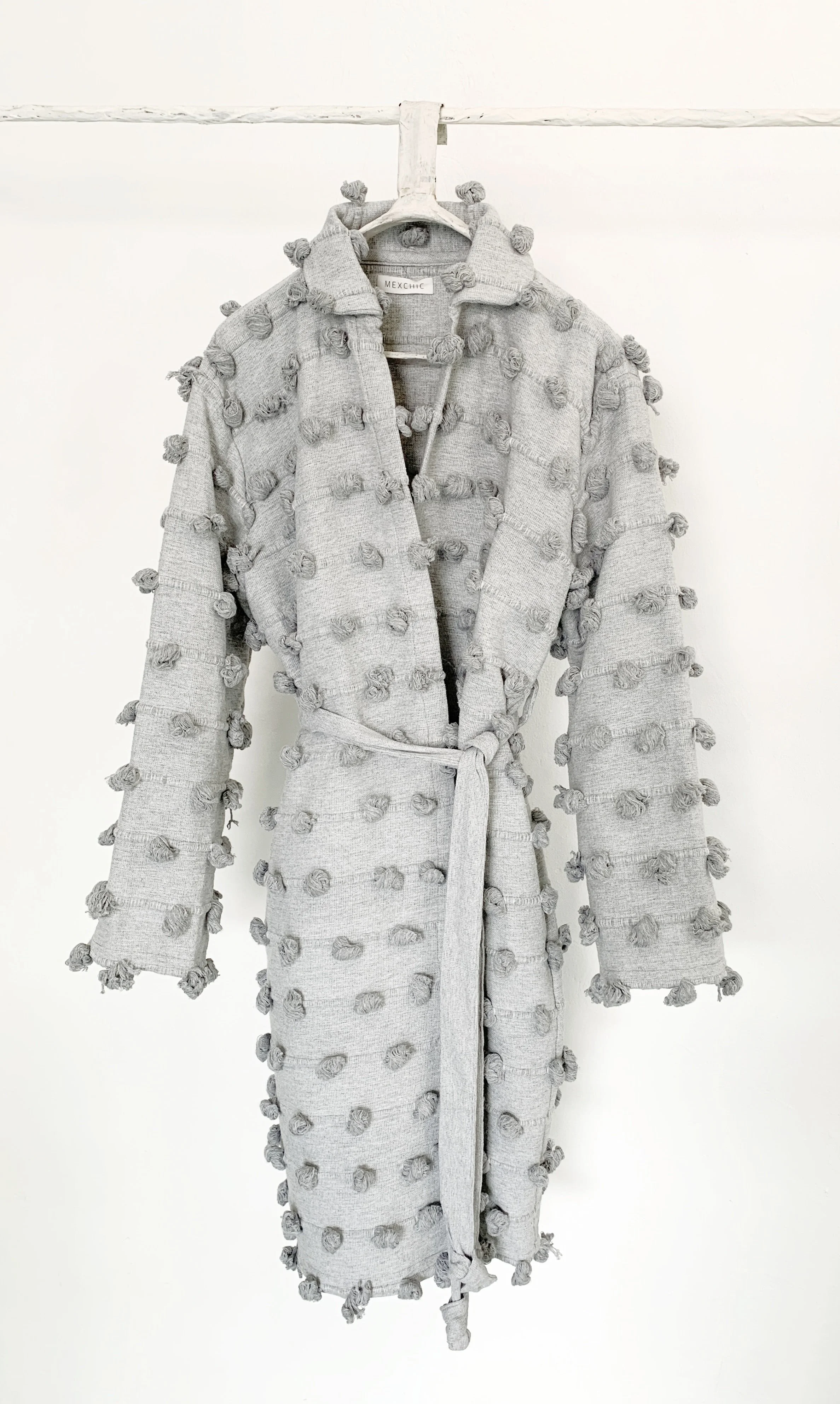 Mexchic clothing collection Anatomy shopping in Oaxaca, Mexico, simple, minimal, minimalist handmade with natural fabrics and fibers, ecological botanical dyes, regenerative cotton, and wool with Mexican artisans, weavers, spinners, red pottery baro 