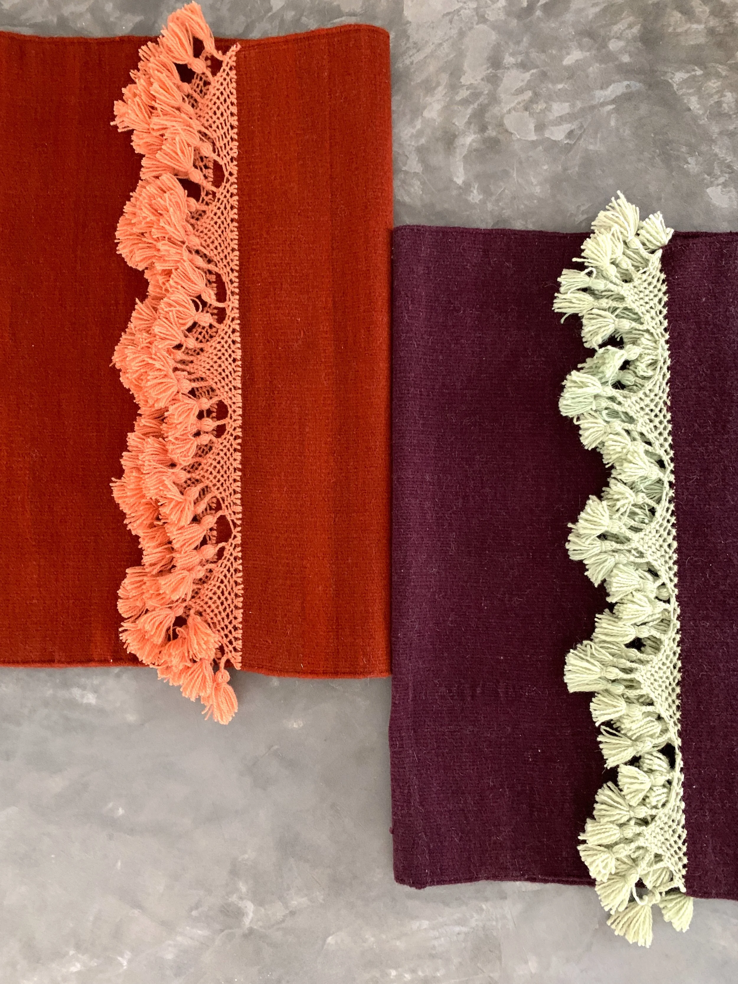 hand woven rug rugs oaxaca teotitlan del valle oaxaca mexico mexican fringe macrame hand knotted pom pom merino wool argentinian wool high quality home goods luxury artisan craft natural dyes botanically dyed hand dyed melon pink peach pink red ochre