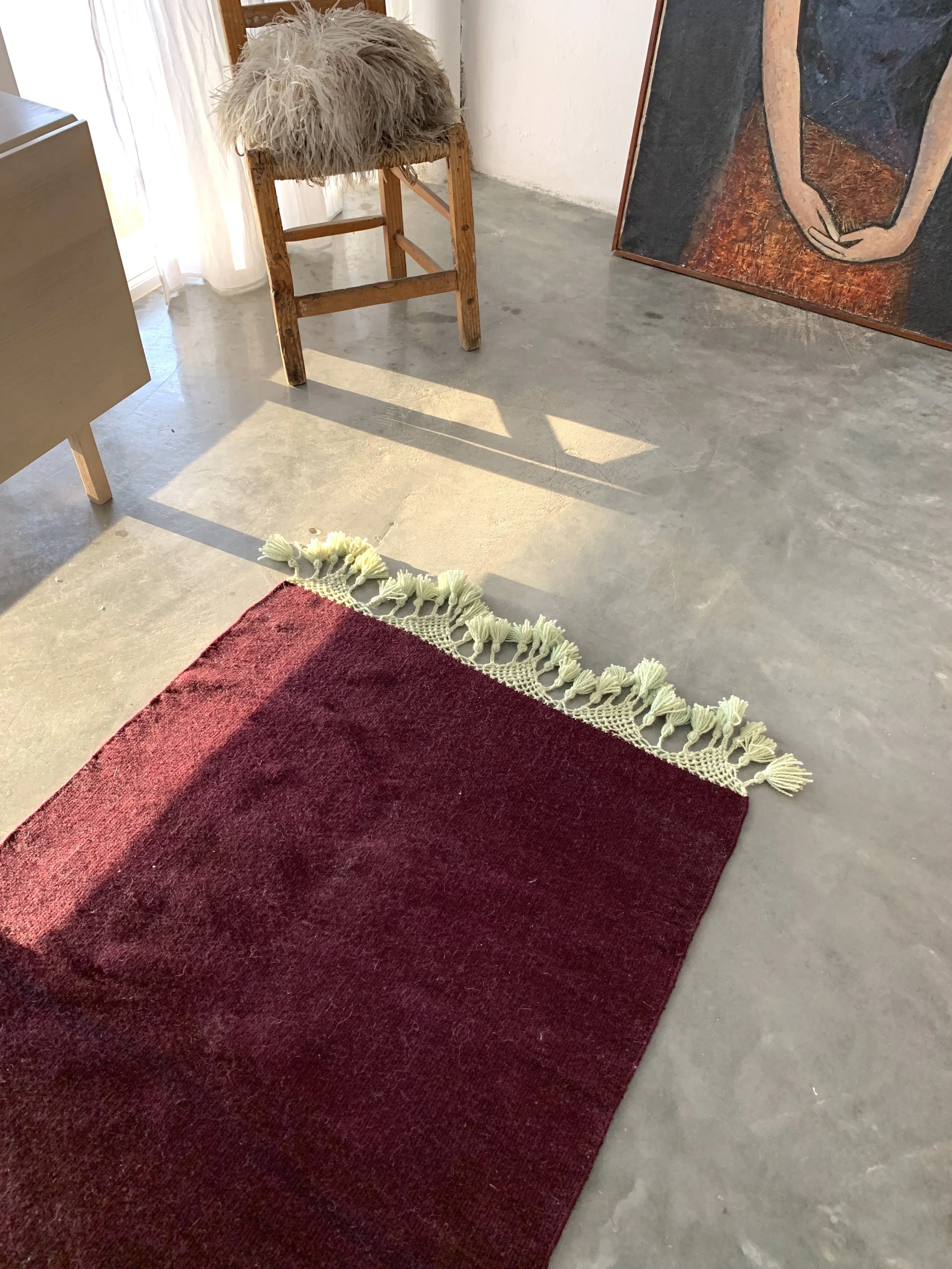 hand woven rug rugs oaxaca teotitlan del valle oaxaca mexico mexican fringe macrame hand knotted pom pom merino wool argentinian wool high quality home goods luxury artisan craft natural dyes botanically dyed hand dyed melon pink peach pink red ochre