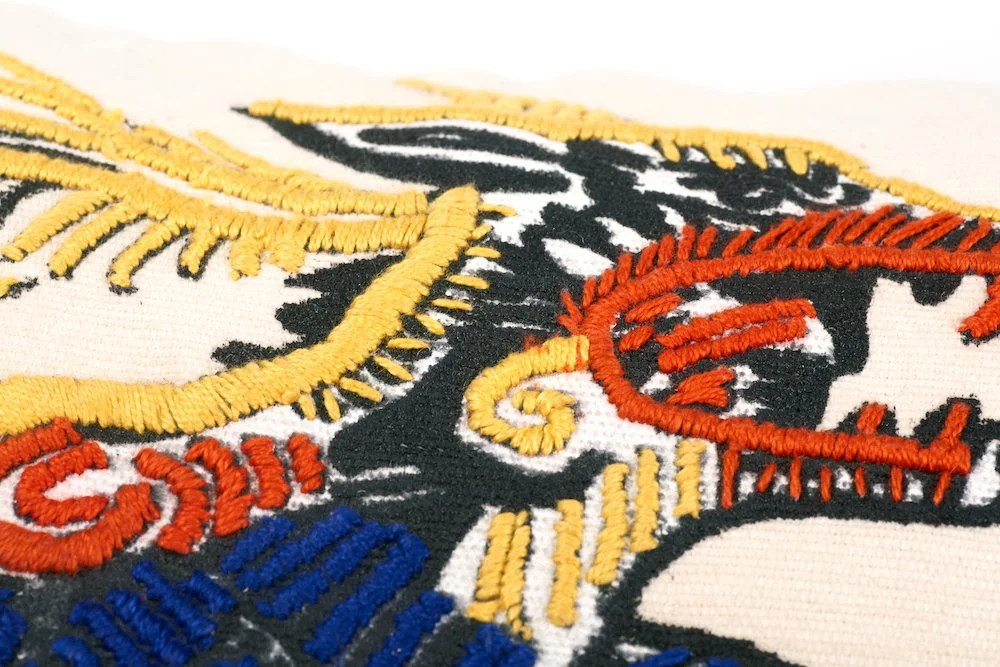 hand embroidered pillow throw decorative oaxaca mexico embroidery silk screen artist aztec miguel hernandez malinalco painter mexchic orange yellow pink purple blue green eagle deer lobo wolf iconography contemporary design designer  