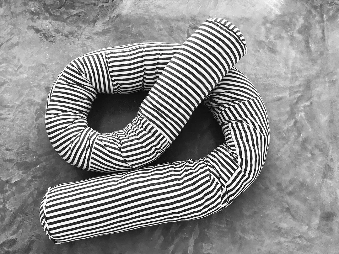 Mexchic Quetzalcoatl handwoven cotton pillow serpent snake seat chair oaxaca  mexchic wool contemporary design aztec pop culture soft sculpture Sol Lewitt linear black and white stripe