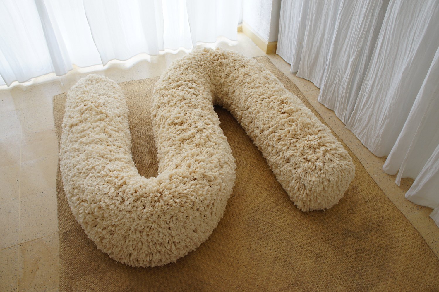 Mexchic Quetzalcoatl handwoven cotton pillow serpent snake seat chair oaxaca  mexchic wool contemporary design aztec pop culture soft sculpture shagg shag 1970's cotton cream bone