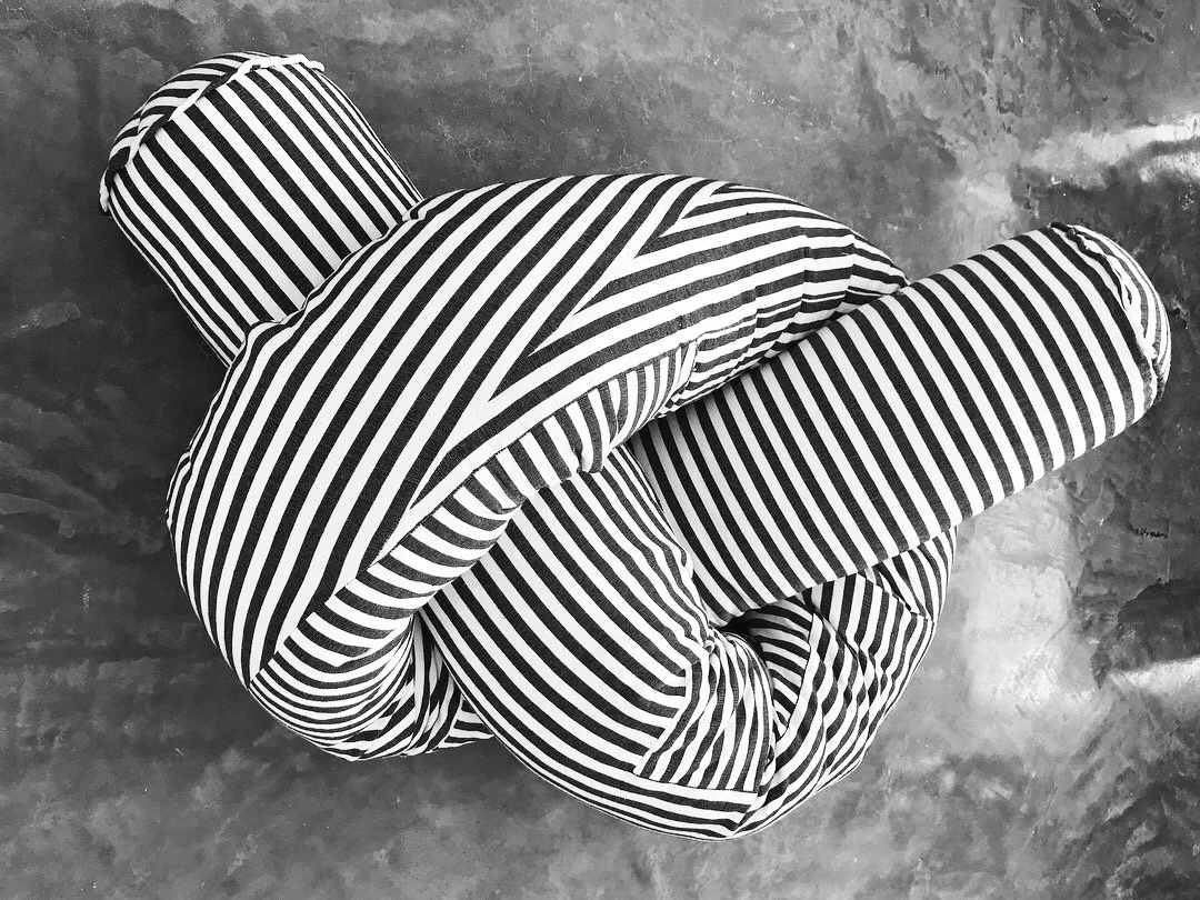 Mexchic Quetzalcoatl handwoven cotton pillow serpent snake seat chair oaxaca  mexchic wool contemporary design aztec pop culture soft sculpture Sol Lewitt linear black and white stripe