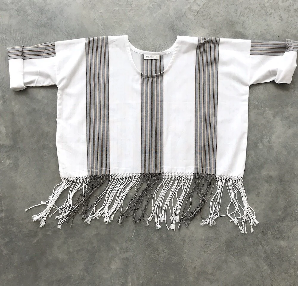 handwoven craft cotton embroidery macrame fringe rebozo shawl mexico mexican oaxaca chiapas toluca tenancingo estado de mexico highend highfashion moda textiles artisan artisanal natural dyes botanical dyes blue black plaid check blouse poncho top sh