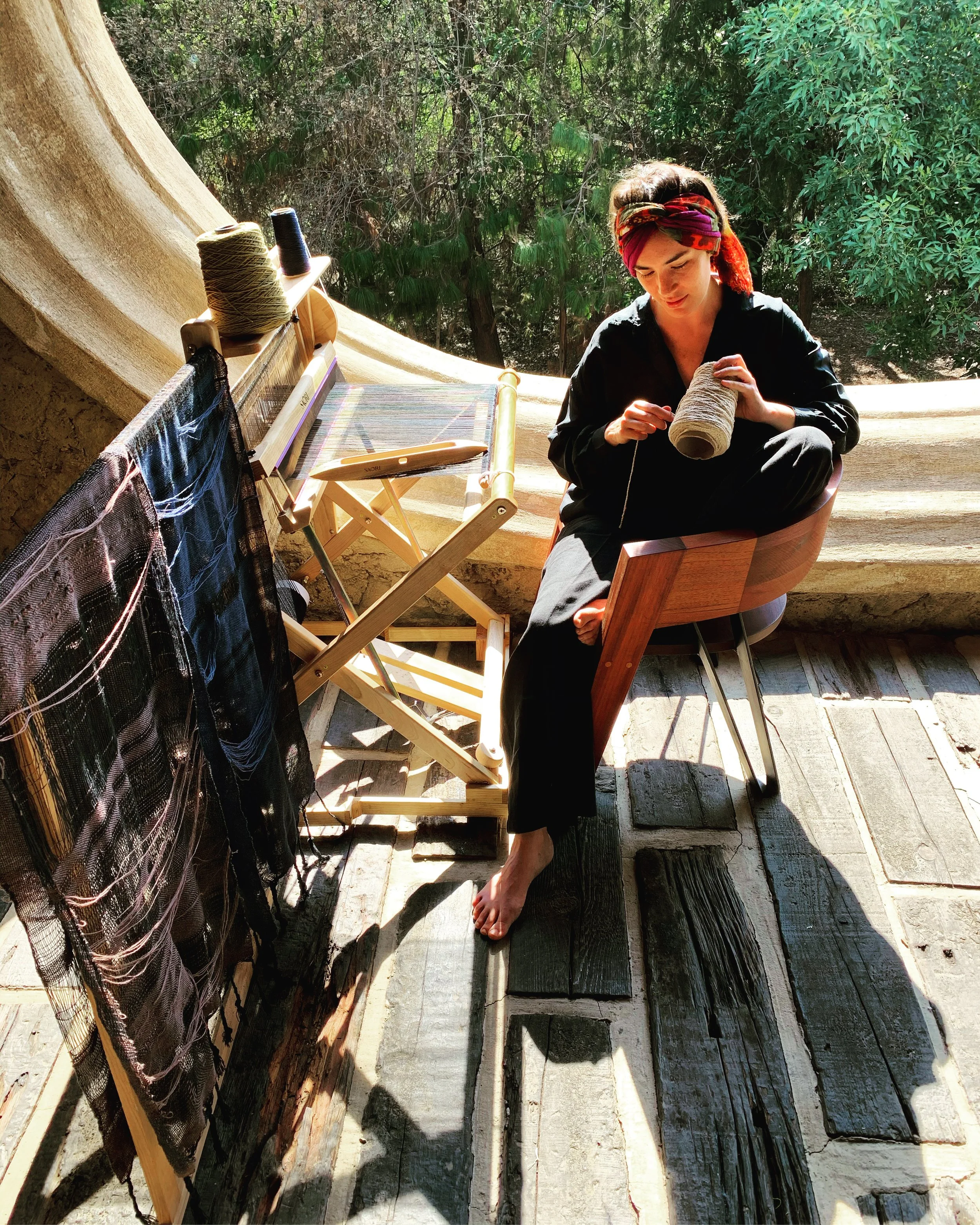Textile artist weaver Jimena Rangel in her studio in central Mexico on her Saori loom in collaboration with Mexchic 