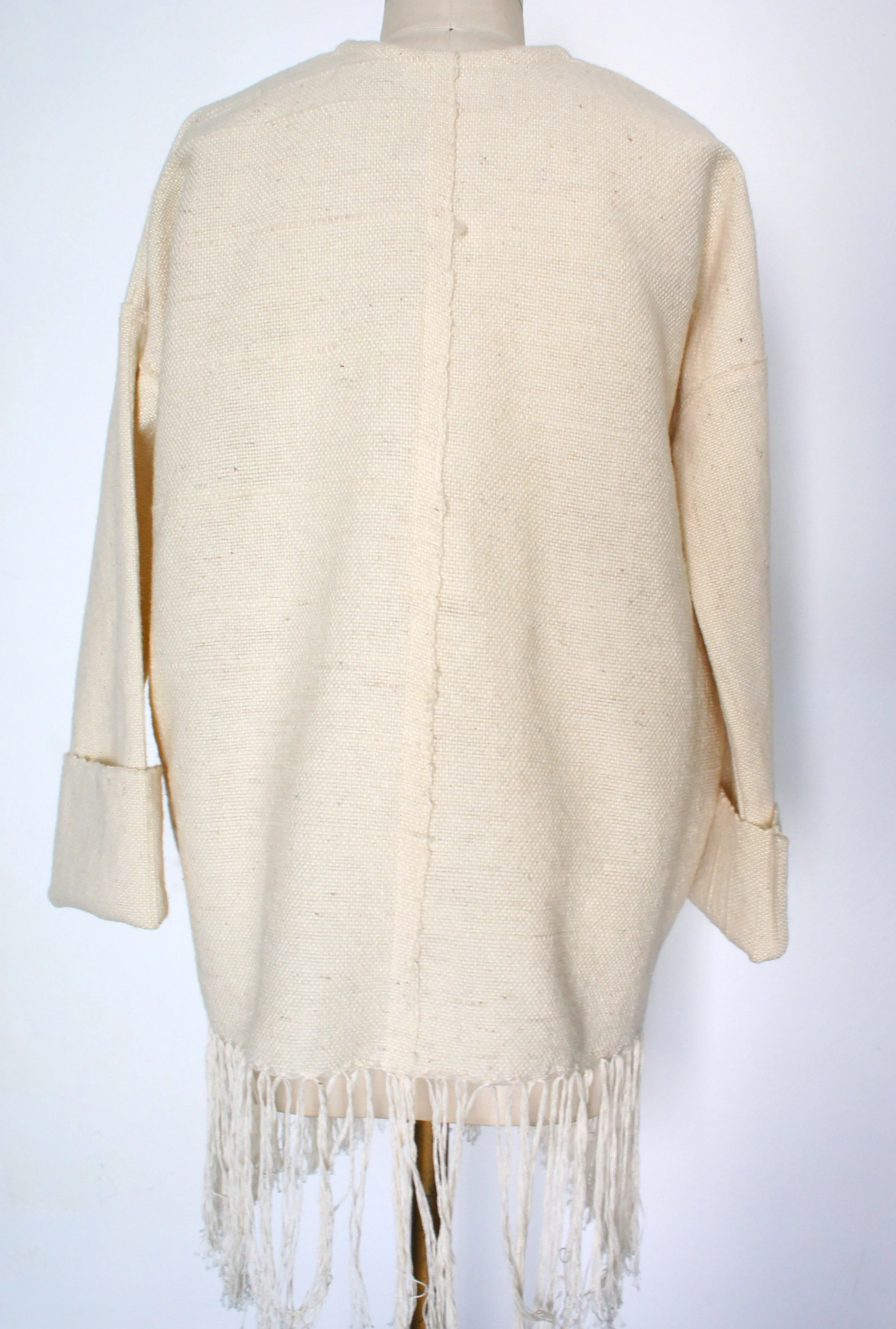 Mexchic Lightweight jacket with fringe, created in collaboration with Mexican textile artist / weaver Jimena Rangel. Handwoven on a Saori loom, in her studio located in Central Mexico, with a lovely soft and plush rustic wool procured from local shee