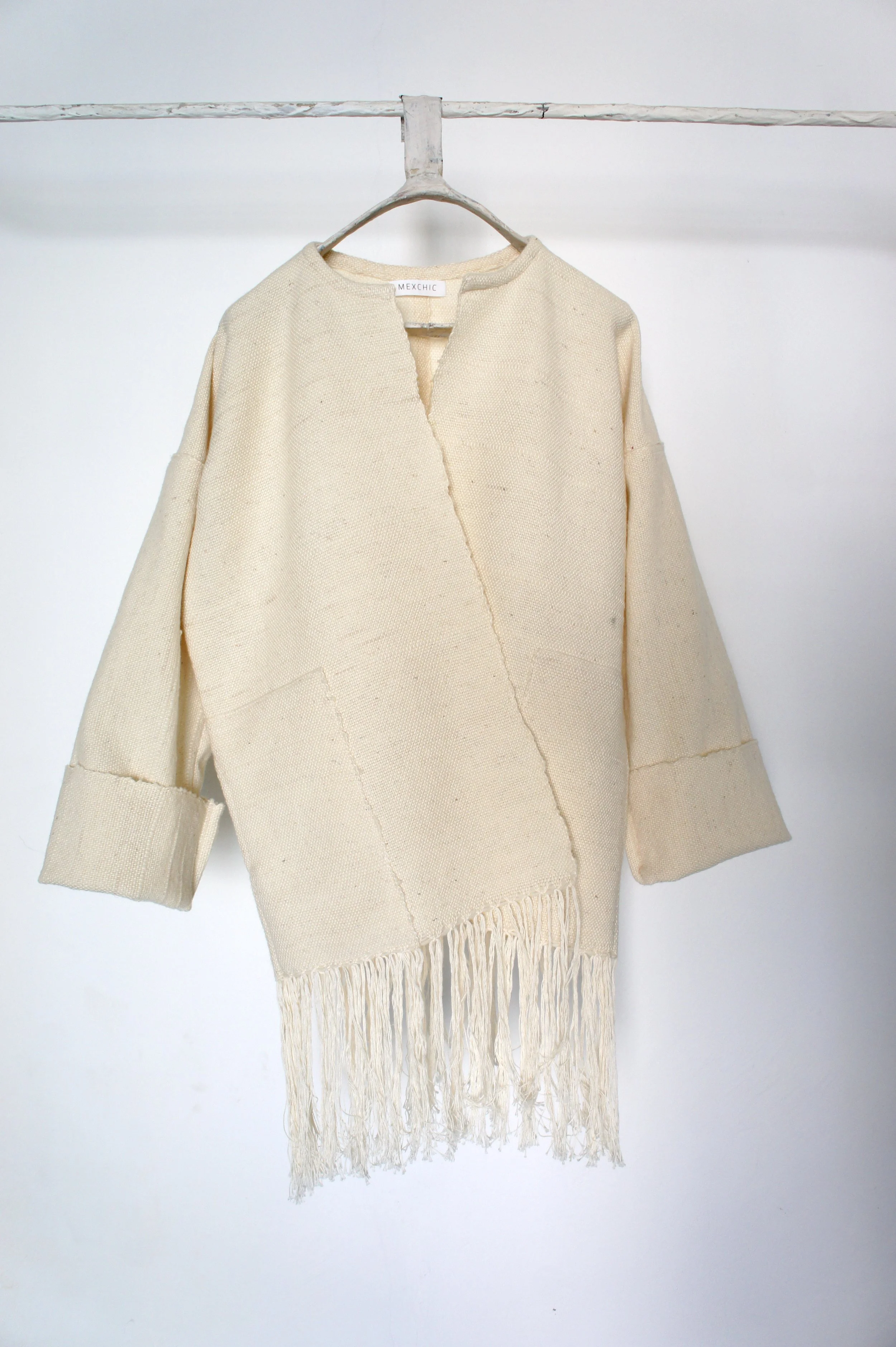 Mexchic Lightweight jacket with fringe, created in collaboration with Mexican textile artist / weaver Jimena Rangel. Handwoven on a Saori loom, in her studio located in Central Mexico, with a lovely soft and plush rustic wool procured from local shee