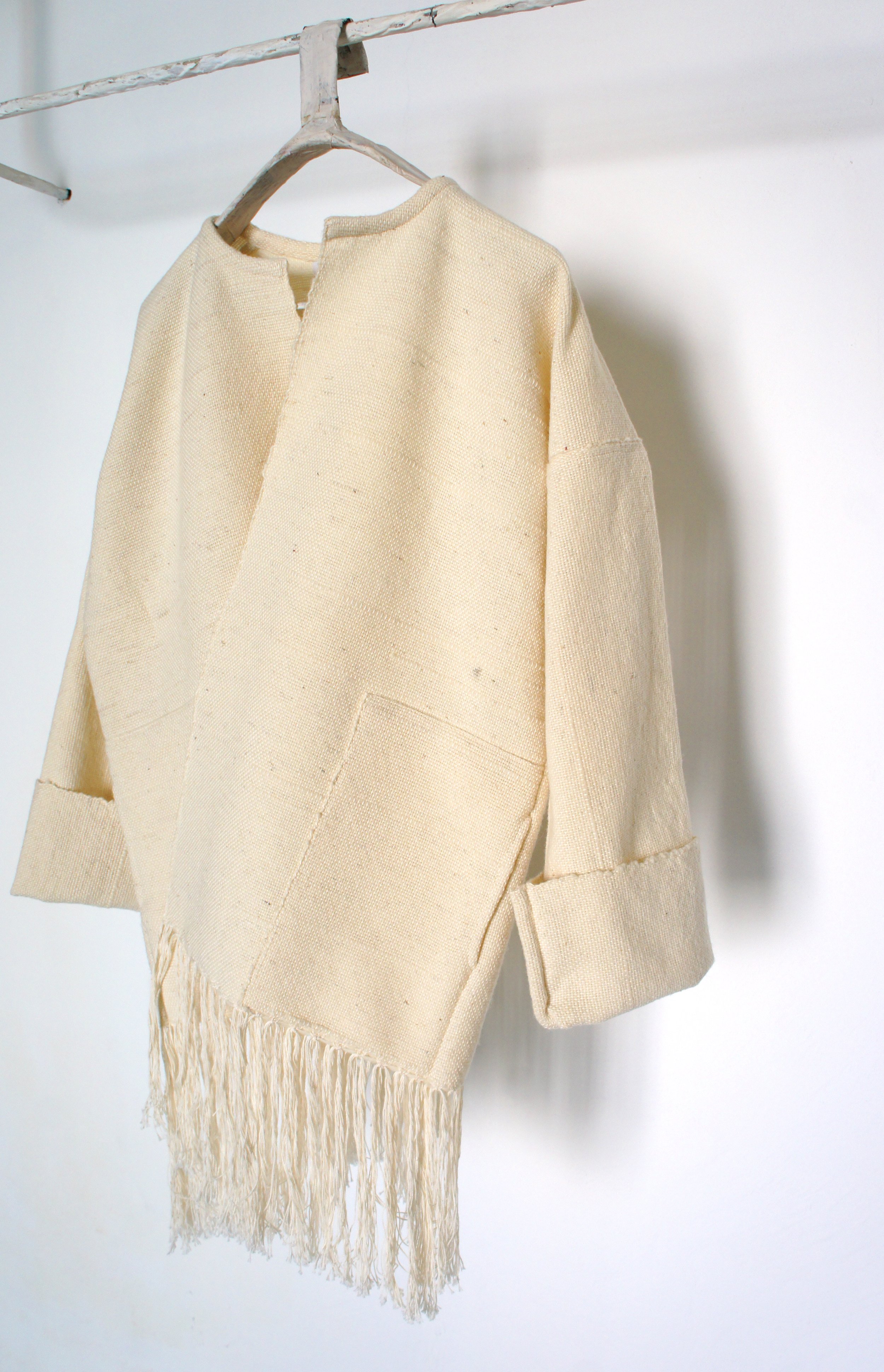 Mexchic Lightweight jacket with fringe, created in collaboration with Mexican textile artist / weaver Jimena Rangel. Handwoven on a Saori loom, in her studio located in Central Mexico, with a lovely soft and plush rustic wool procured from local shee