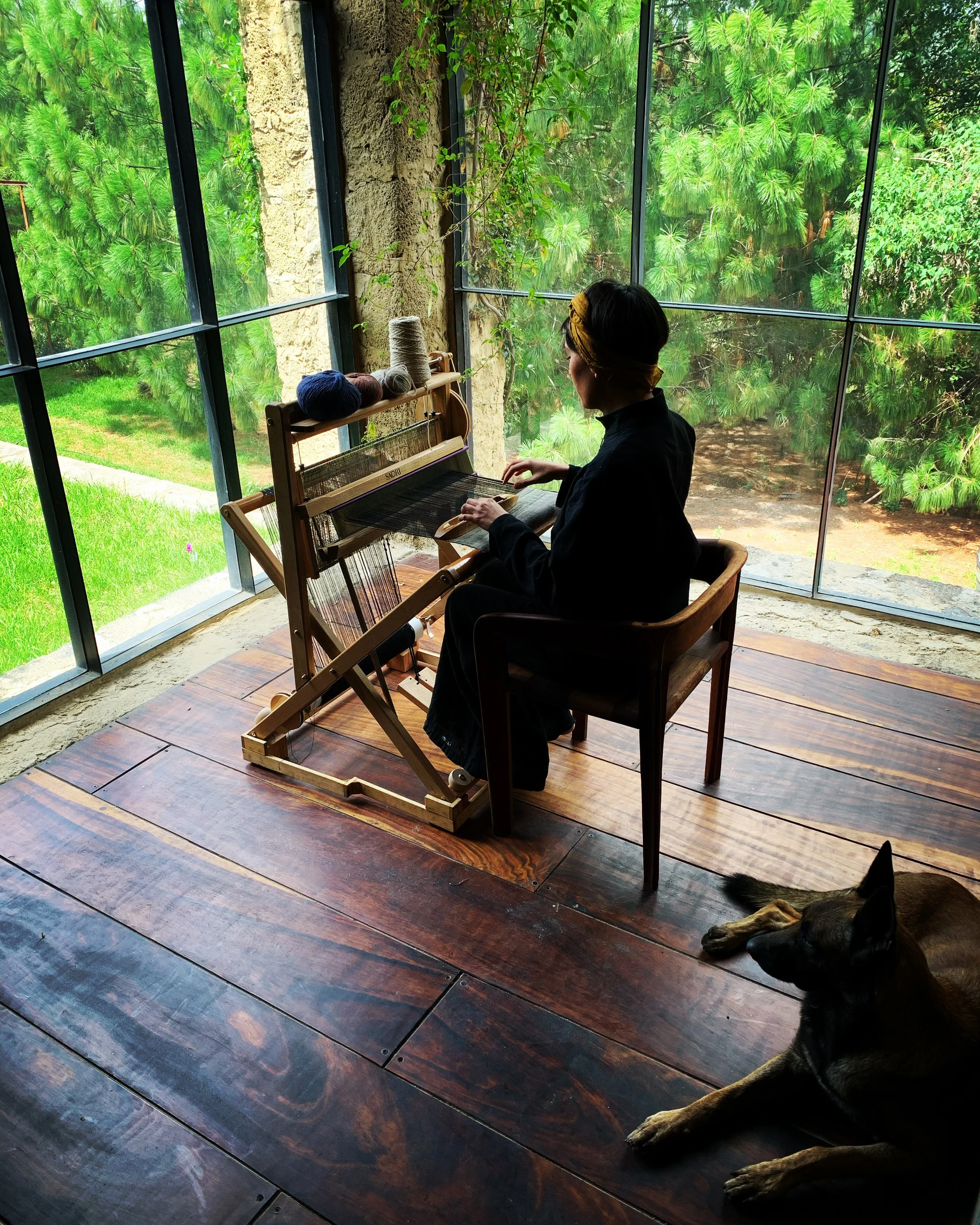 Textile artist weaver Jimena Rangel in her studio in central Mexico on her Saori loom in collaboration with Mexchic 