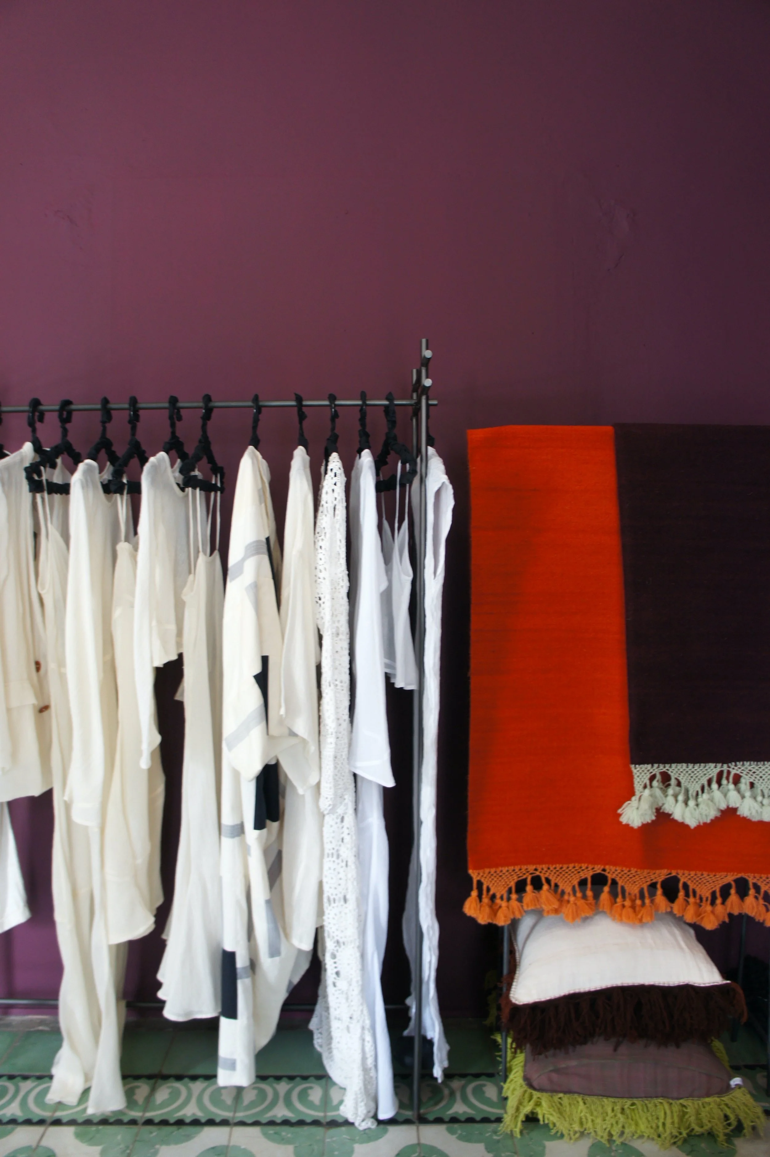 Dark purple walls bright textiles