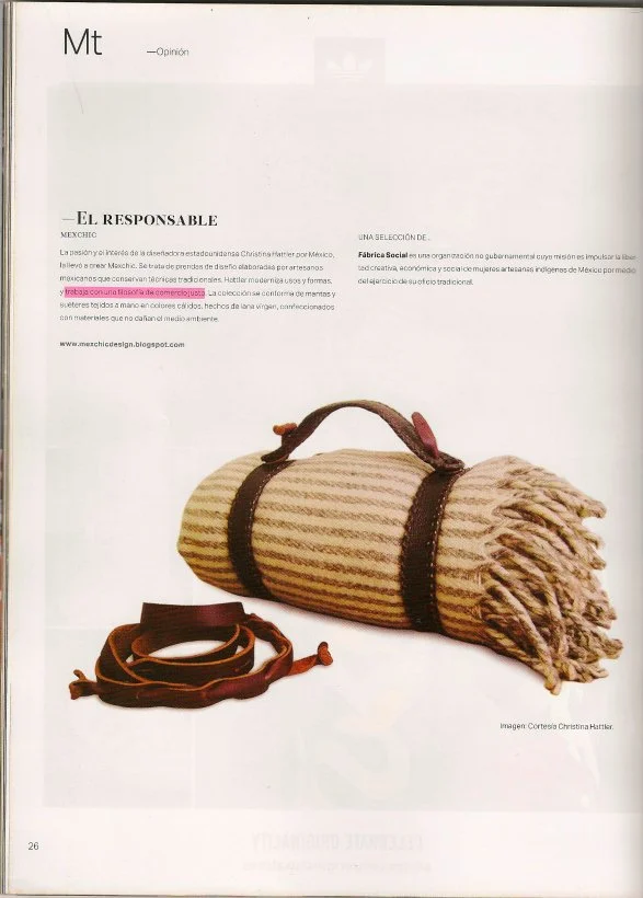 A rolled, striped blanket with fringed edges, secured with straps, a small handle on top, and a separate leather strap accessory, on a white background.
