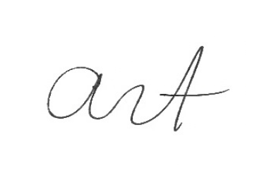 Handwritten word 'art' in cursive on white background.