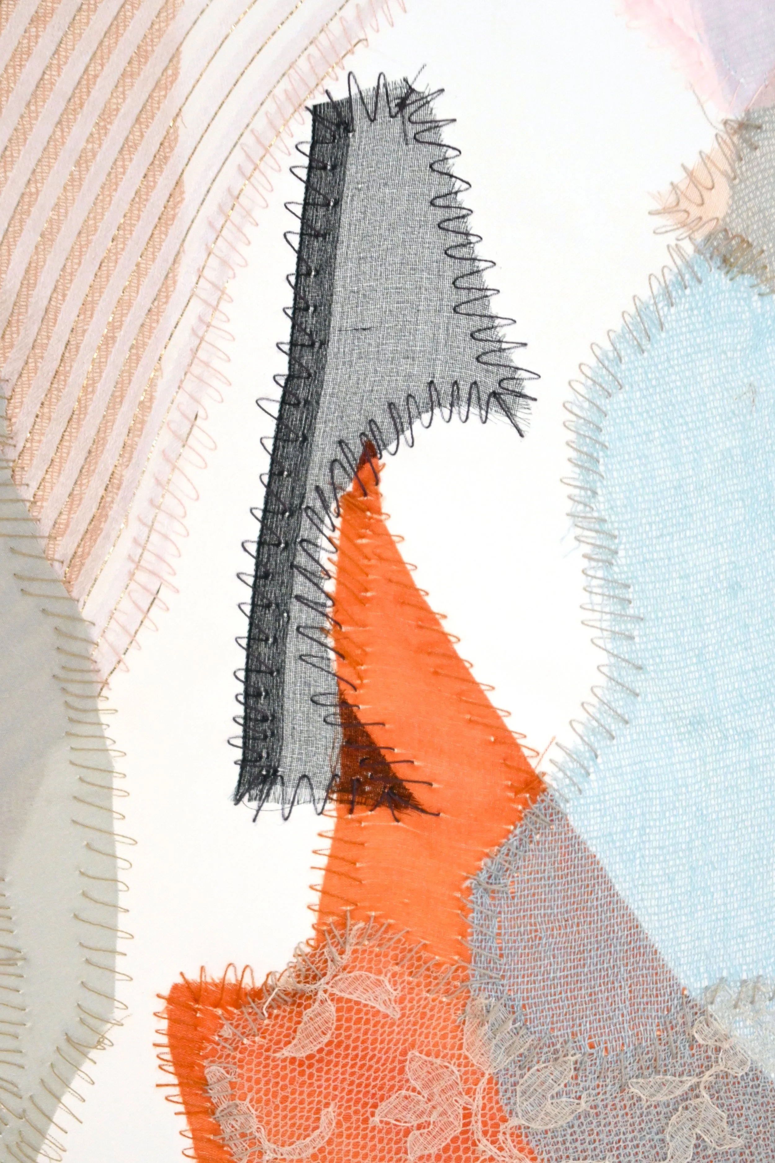 Close-up image of a section of a banknote, showing detailed security features including colorful thread, microprinting, and a section of a holographic or transparent element with intricate patterns.