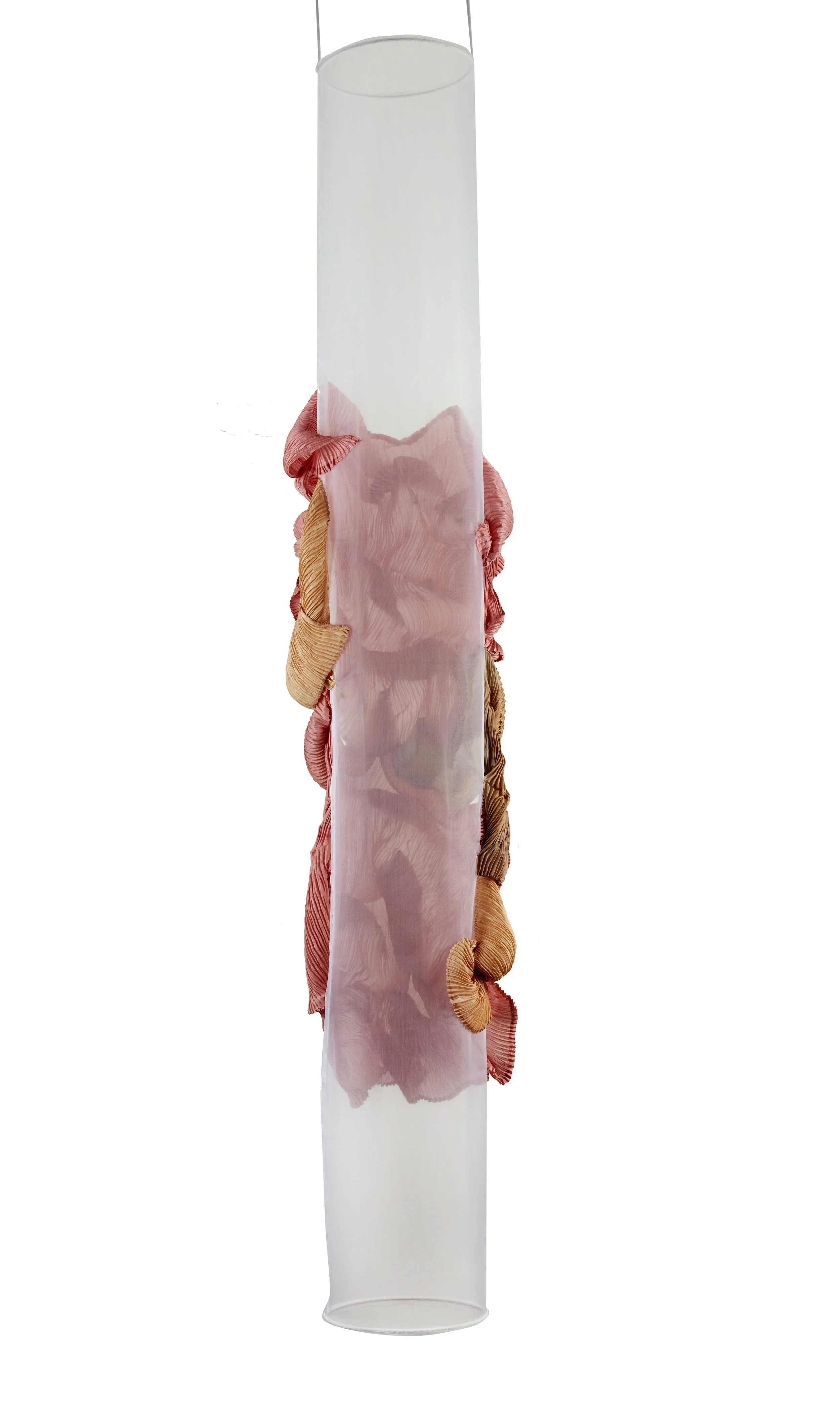A cylindrical transparent plastic tube with pink and peach-colored fabric or material wrapped around it.