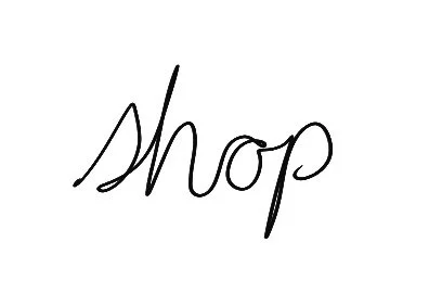 A handwritten word 'Shop' in black ink on a white background.