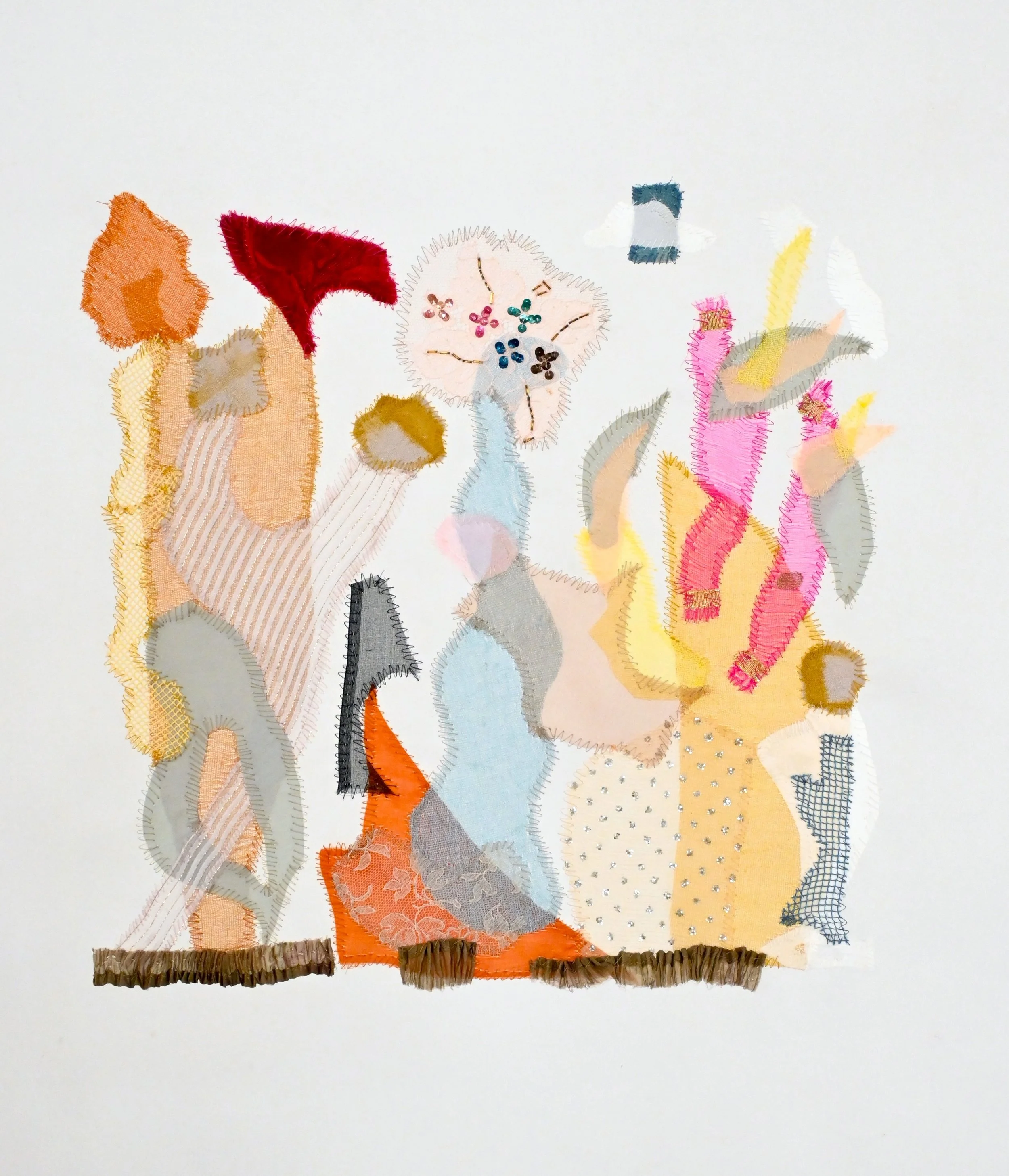 A textile art piece on white background features hand-stitched flowers and leaves in various colors and fabrics, with some textured and embroidered details, resembling a floral composition.