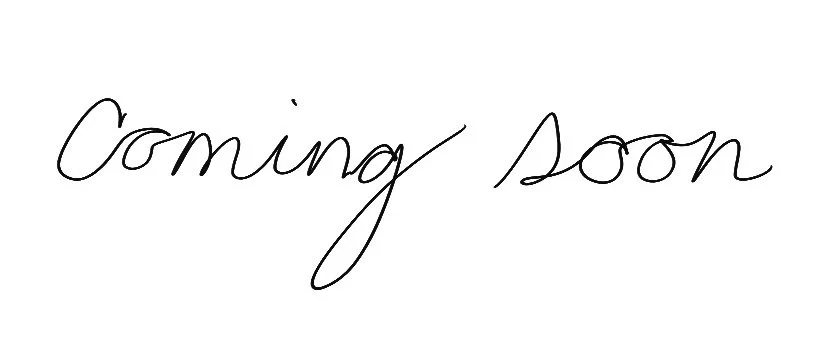Handwritten text that reads 'Coming soon'.}