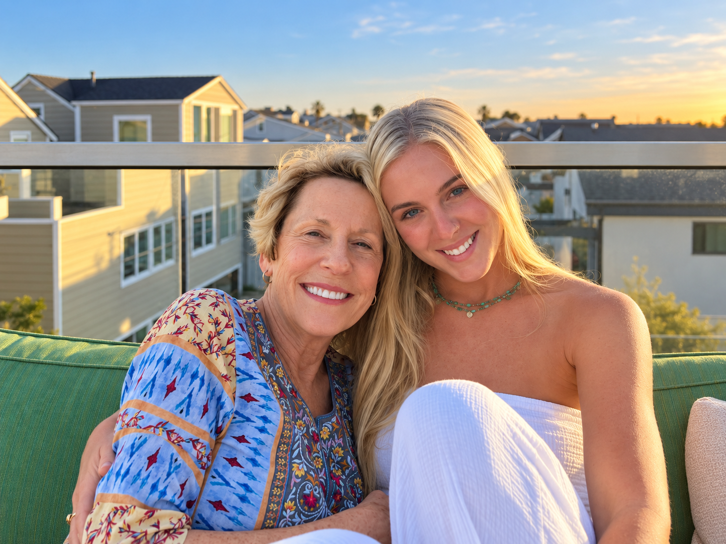 Christin’s mother and daughter smiling together outdoors at sunset