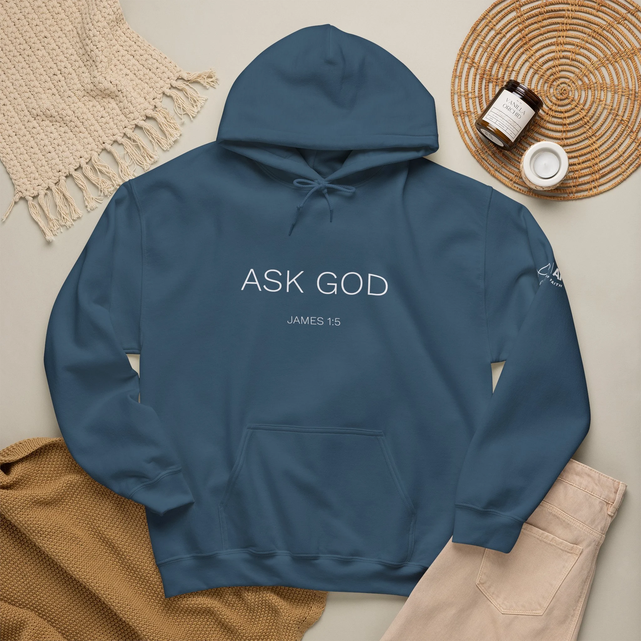 Lifestyle flat lay featuring Articles of Faith Scripture-inspired apparel with ASK GOD on the Front