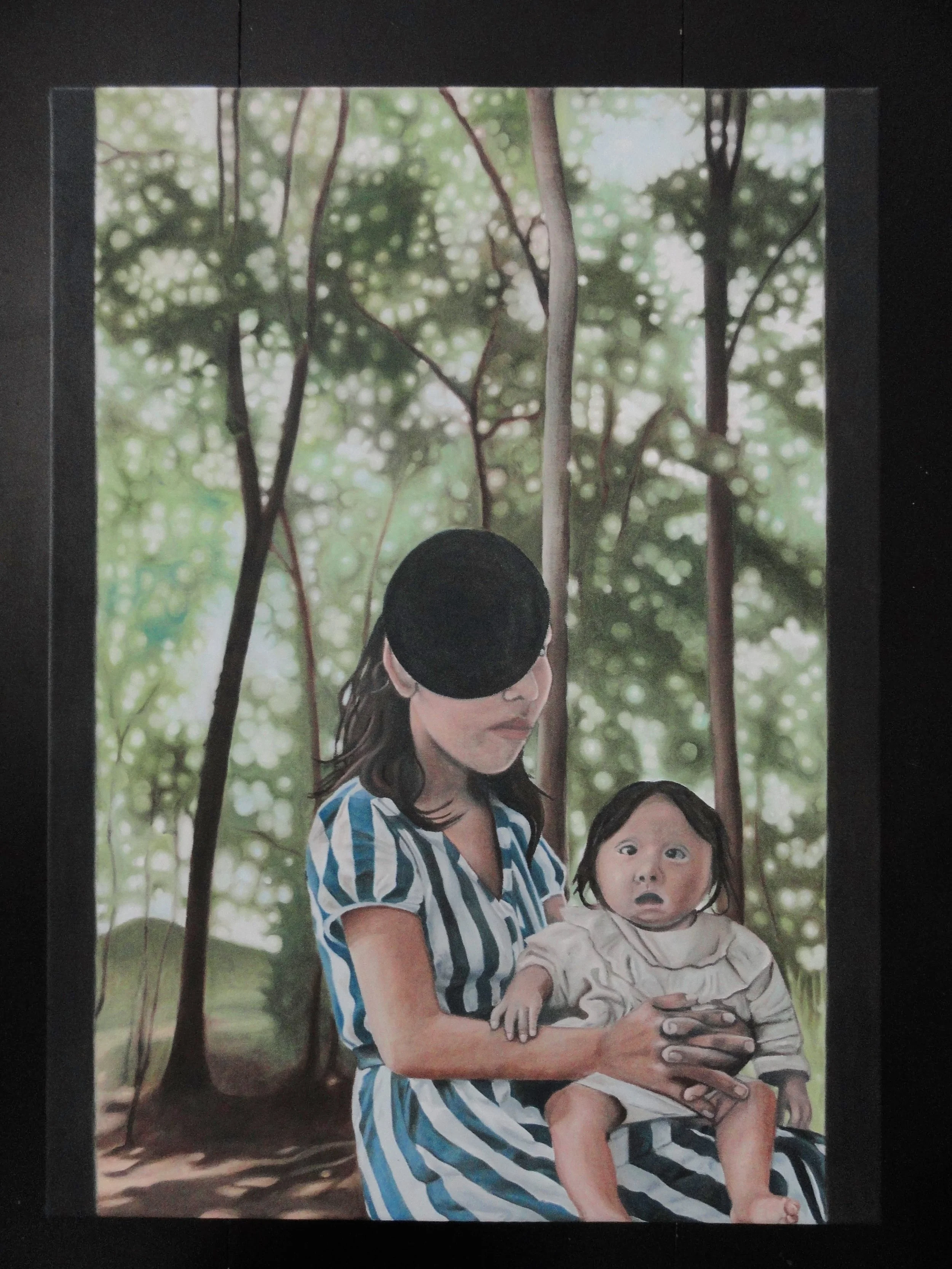 A woman and a young child sitting on a bench outdoors with a blurred background of trees and sunlight filtering through the leaves.