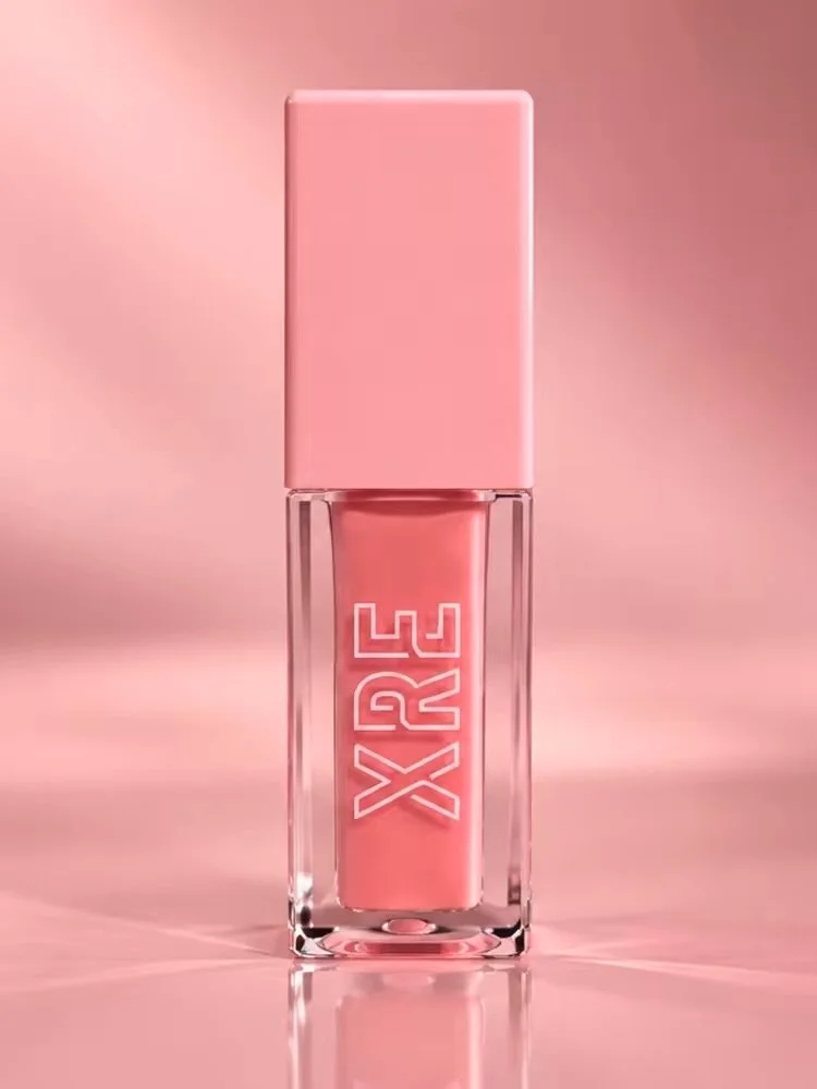 A pink lipstick or lip gloss in a clear glass container with a pink cap, labeled with the word 'XRE' in white.