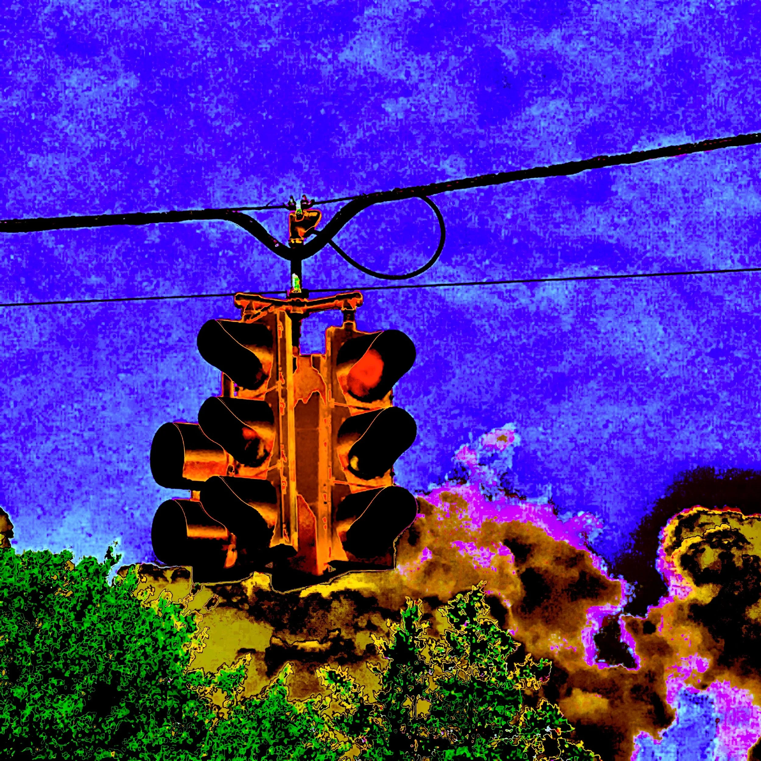 Colorful abstract image of a ski lift with a blue sky background and green, yellow, and pink details.