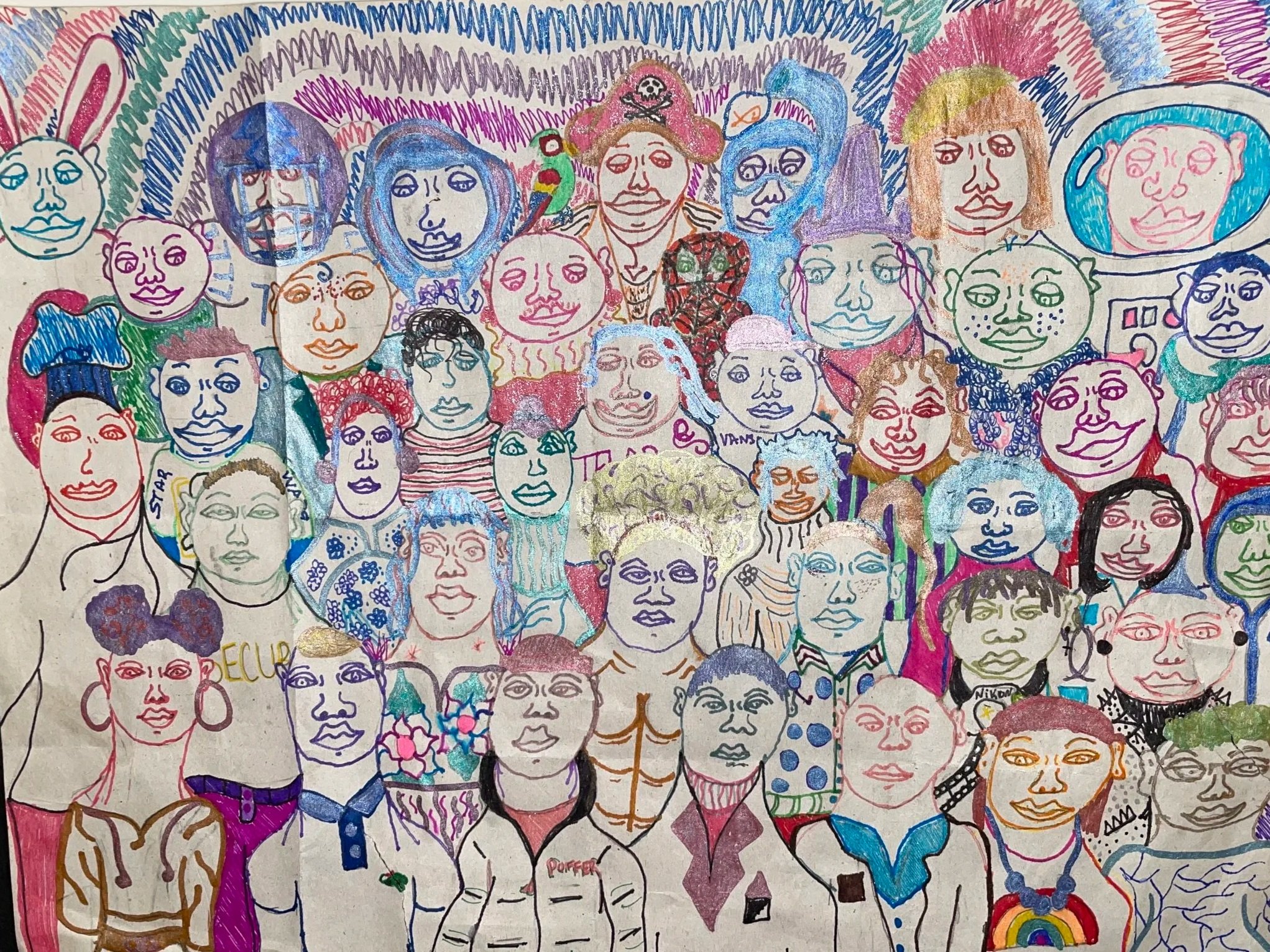 A colorful drawing of numerous diverse faces and characters with different expressions, hairstyles, and accessories, created with various markers and colors.