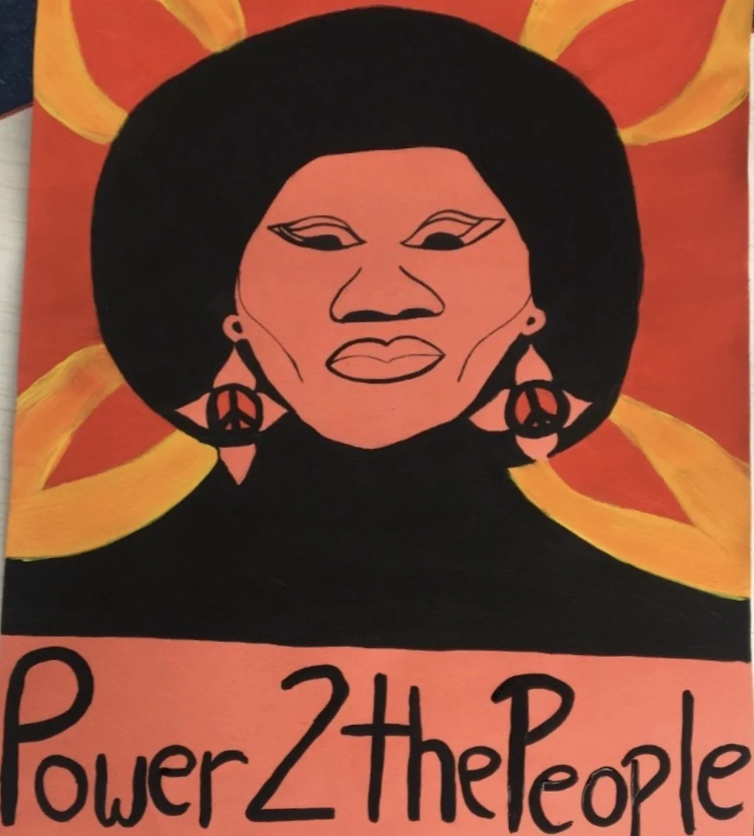 A vibrant poster of a woman with an afro hairstyle, earrings with peace symbols, and an inspiring message that says 'Power 2 the People'.